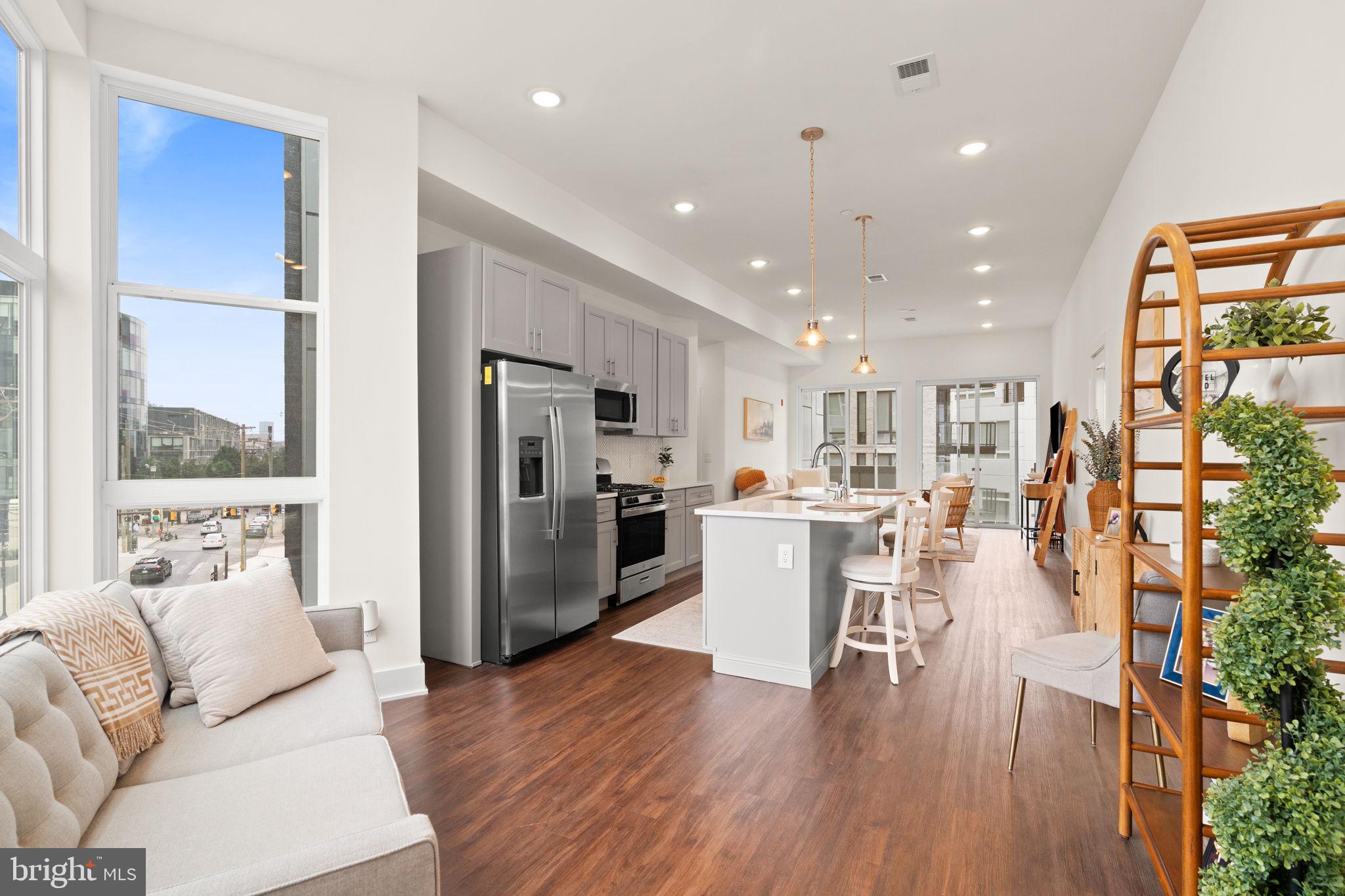 Welcome to 1102 N 2nd Street! This stunning new construction condominium is located in the heart of Northern Liberties, one of Philadelphia's most desirable and dynamic neighborhoods. As you step inside, be greeted by an abundance of natural light pouring in through the floor-to-ceiling windows, illuminating the expansive open-concept layout. With a combined living and dining space, the kitchen serves as the centerpiece. This chefs kitchen features stainless-steel appliances, sleek quartz countertops, subway tile backsplash, 4 burner gas stove, ample soft-close cabinets for storage and is complete with a spacious island with room for barstool seating. Whether you're hosting a dinner party or enjoying a quiet evening in, the seamless flow between the dining and living areas creates an inviting atmosphere for entertaining or relaxation. Off of the living room, you can gain access to the balcony that overlooks all that 2nd street has to offer. This condominium includes three bedrooms, each offering plenty of space & abundant closet storage. The primary suite is complete with a private balcony where you can savor your morning coffee, a spacious walk-in closet, and an en suite bathroom boasting a large stall shower and double vanities. Indulge in the convenience of residing in the same building as the exclusive two-level community fitness center. Located right off of 2nd Street, your condo is not only steps from some of the most popular bars and restaurants that Northern Liberties such as Figo, El Camino, Urban Village Brewing Company, One Shot Coffee, Standard Tap - but right across the street from Acme, Wine & Spirits, Solidcore, Heirloom GIANT market and so much more! Schedule your showing today!