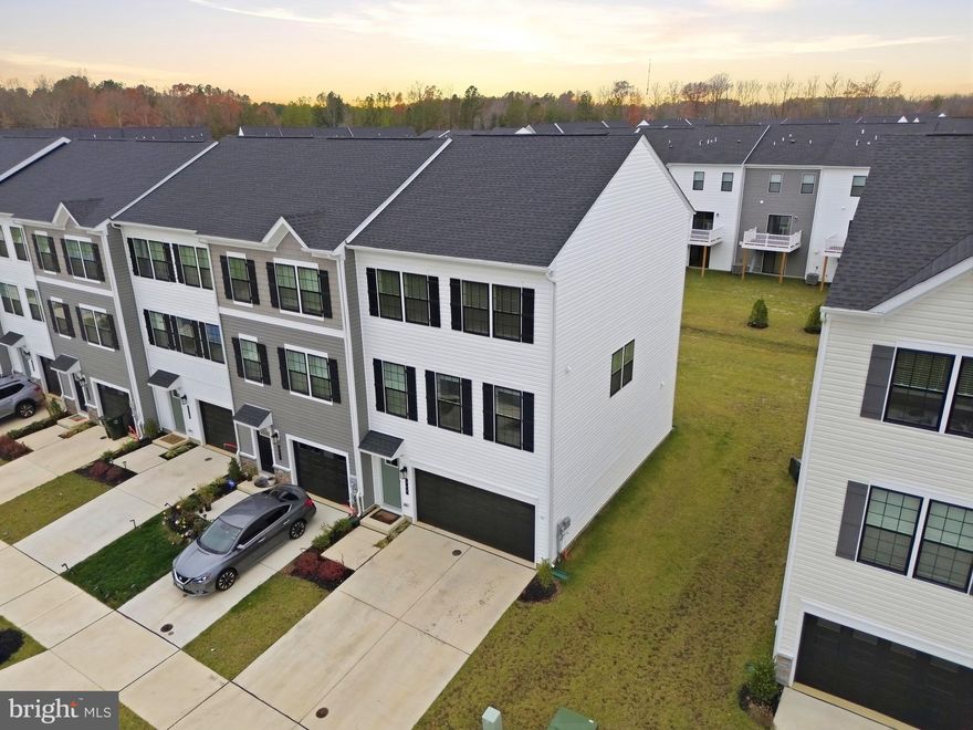 Modern 3-Level End-Unit Townhome Built in 2024!  There is a tenant that lives in the lower level. That tenant has no access to the rest of town-home or garage. Utilities are split: 80% paid by main tenant & 20% paid by lower tenant. Minimum credit score of 640 for all adult tenants and minimum monthly income of $7,500.

Step into contemporary living with this stunning end-unit townhome offering three spacious levels and an abundance of natural light. The entry level welcomes you with a convenient foyer and an attached garage for easy access and storage.

Upstairs, the main level boasts an open-concept layout perfect for both everyday living and entertaining. Enjoy a stylish kitchen featuring stainless steel appliances, ample cabinetry, and a large island that flows seamlessly into the dining area and bright living room. A private deck just off the kitchen provides the ideal space for morning coffee or outdoor dining. A modern half bath completes this level.

The upper floor offers three generously sized bedrooms, including a comfortable primary suite with its own full bath. An additional full bathroom and upper-level laundry add to the home's practicality and comfort.

Built in 2024 and thoughtfully designed throughout, this home is located just minutes from shopping, restaurants, and daily conveniences. Don’t miss the opportunity to enjoy modern living in a prime location!