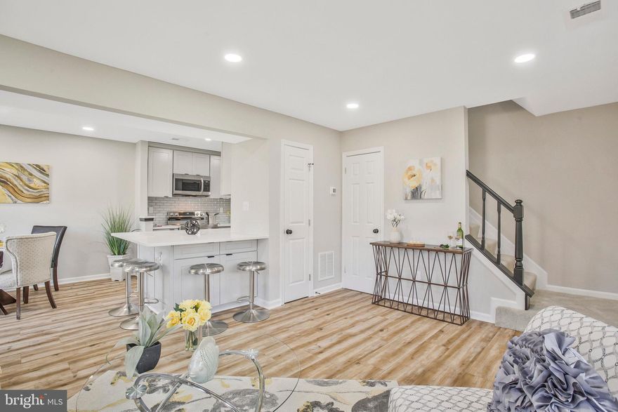 ***ASK ABOUT LOWER INTEREST RATES!***This end unit townhome has been tastefully renovated from top to bottom. Every detail has been meticulously crafted and thoughtfully chosen. Upon entering the main level, you'll immediately notice the seamless open concept, combining the living room with a beautifully remodeled kitchen. The kitchen boasts high-end cabinets, Calacatta Ultra quartz countertops, and a luxurious glass tile backsplash. The focal point of this home is the intelligently designed breakfast bar, perfect for savoring your morning coffee or evening cocktail. Additionally, a brand-new kitchen appliance package, including a washer and dryer, is included. Convenience is key, as the powder room is discreetly nestled alongside a laundry room with extra storage space. The main level features stunning Golden Macchiato water and scratch-resistant wide plank luxury flooring throughout. Sliding door off the living rooms is leading to fenced in backyard ideal for relaxing and entertaining. Moving to the upper level, you'll discover ample space with three generously sized bedrooms and a fully updated bathroom in the hallway. Plush carpeting graces the second level and stairs for added comfort. To top it off, this home comes complete with a one-car attached garage featuring a newly installed garage door with remote opening and closing functionality. Don't miss the opportunity to call this fantastic location your new home!