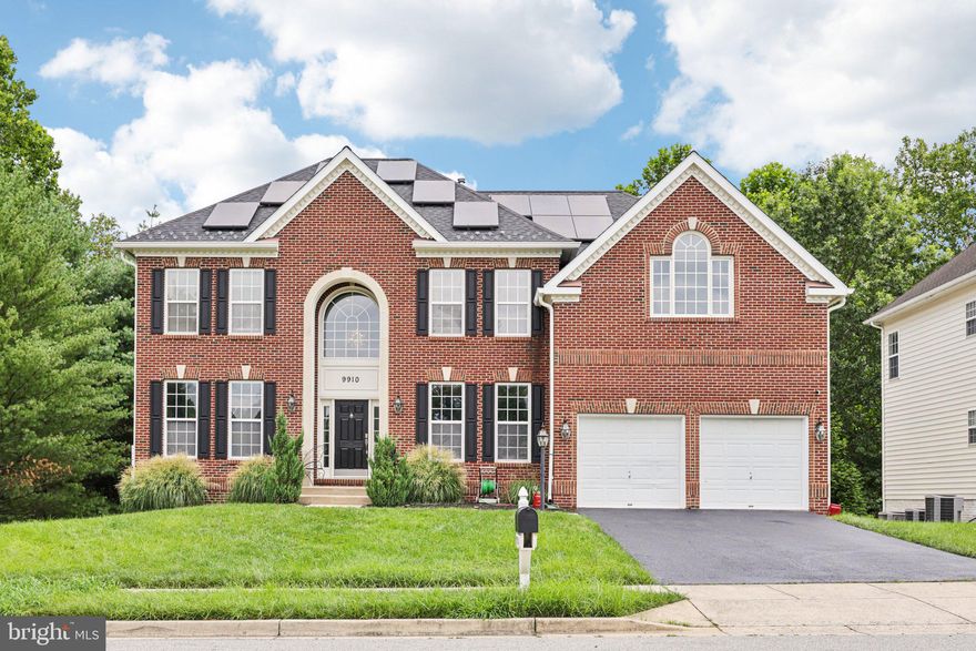 Spectacular brick-front Colonial ready for you! Step into the impressive two-story foyer with abundant light streaming in from all sides. The main level offers a wonderful flow from the formal living and dining rooms to the dramatic family room featuring high ceilings,  a wall of windows, and an open sightline to the chef’s modern kitchen with stylish white cabinetry and stainless steel appliances. Enjoy the fabulous sunroom extension overlooking the backyard. Main level also offers a convenient office space as well as a powder room. A sweeping staircase leads to the upstairs bedrooms, including a luxurious primary suite with a sitting room and spa-like bathroom. This level also offers three additional bedrooms, a hall bath, and elegant bird’s-eye view of the living areas below. The fully finished lower level is perfect for entertaining or guests, complete with a spacious rec room, kitchenette, guest bedroom, bonus room, and full bath. Welcome home!