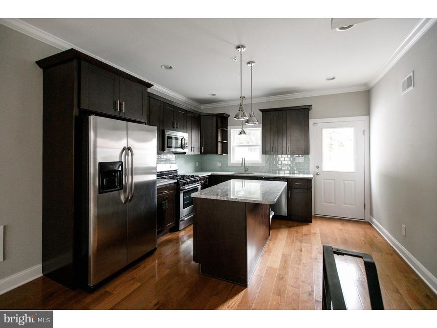 A gorgeous new construction home you need to see! Found on a quaint residential street, enter and discover desirable details throughout, including hardwood flooring, corner beaded walls, recessed lighting and large windows for plenty of natural light. The home features a large living room with built in speakers and an open dining room showcasing any furniture arrangement to suit your taste. Continue into the kitchen, complete with granite counters, stainless steel appliances, tiled backsplash and access to a concrete rear yard: perfect for lounging on sunny days! The second floor features two light filled bedrooms with ample closet space, and a full tiled bath with tub and shower. The third floor reveals a fabulous master suite with walk in closet, trey ceiling with lighting, a full bath with stall shower with a frameless glass enclosure. Be sure to stop by the 3rd floor's wet bar before heading up to the full sized roofdeck with built in speakers and tons of builtin lightiing, just the spot to sit back and admire the fantastic view. Still not enough room for you? Check out the full finished basement, with full tiled bath for your comfort & convenience. At this location you are close to all the Fishtown/Norther Liberties restaurants and night life as well as great parks and easy access to I-95. Don't wait, schedule your showing today!