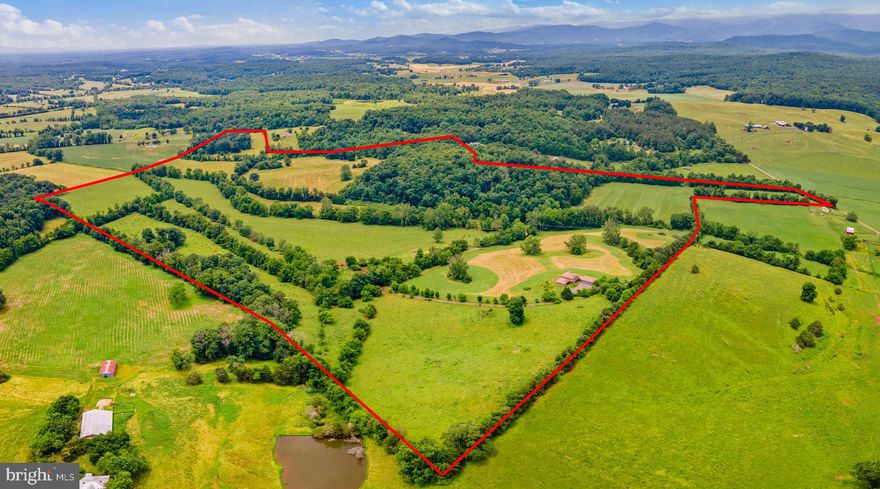 A Truly Incredible & Remarkable Find! 153 gorgeous acres in sought after Madison County with a one-of-a-kind 5,000+ sq/ft 3 Bed/4 Full/2 Half bath home with beautiful mountain views!  A wonderful blend of hardwoods and pastures and boasting frontage on both Novum Church Road and Hoover Road with Deep Run running through the property - an absolute ideal candidate for conservation!  A winding driveway takes you through woods and along and across your own bridge over Deep Run as you make the ascent to the hilltop oasis.  There, sits a spectacular home.  Thoroughly custom, inside and out, it is anchored by an unbelievably massive three story stone fireplace.  Enter the home through the vestibule into the two story family room and formal dining room and you'll be sold.   Tongue and groove hardwood floors, walls and ceilings ensconce you in a breathtaking escape from the normal and mundane. Gourmet kitchen with copper backsplash, island and stone fireplace offer a fantastic space to cook or relax in the breakfast nook and take in the mountain views.  Oversized primary bedroom and bath offer dual walk in closets, huge roman soaking tub and walk-in shower.  Upstairs boasts two bedrooms, both with their own private baths and a catwalk/overlook to the great room below.  The lower level presents a huge rec room with wood stove, two baths (one with space for a yet to be completed sauna or steam room) and a large office with built-ins and it's own fireplace. Don't miss the 3 car garage connected via breezeway to the main residence - it would make an ideal shop!   There is so much to see and do at this property ... it would make a great horse property, is already a working cattle farm or whatever your imagination can conjure!  All at a very competitive price that is hard to beat! Make sure your check out our Matterport 3D Tour and Aerial Drone Video Tour of the farm!