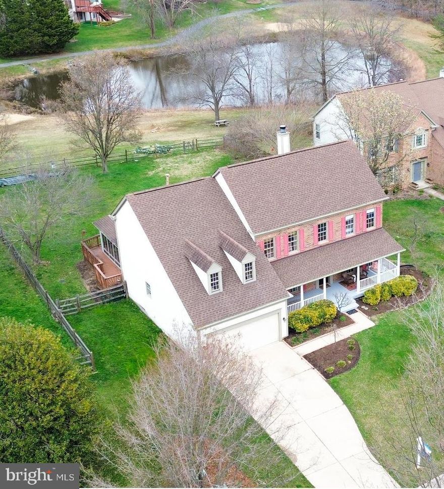 OPEN HOUSES this weekend - today, Saturday and Sunday. The best of both worlds - a serene retreat within a vibrant community. Located in the sought after neighborhood of Crosspointe in Fairfax Station, this beautiful home is nestled in a cul-de-sac and features over 4000 ft.² of living space.  Center island kitchen with updated appliances and a breakfast area that flows  to a four season screened sunroom. The sunroom is a standout feature and a favorite gathering spot for family and friends all year long. You will also find a family room, living room, butler pantry, dining room, powder room, and private office with hardwood floors on the entry level.  The office has built in bookcases, a fireplace and beautiful french doors.  Upstairs in the primary suite, enjoy watching the sunrise and the pond view daily. The primary suite also offers a sitting space, vaulted ceilings, an extra large 16'x 6' walk-in closet and bathroom with double vanities and soaking tub.  Three other generously sized bedrooms and a full bath complete the upper level.  The lower level features a huge recreation room, full bathroom, exercise room and bonus room for guest/play area/extra office.  There is ample storage with the lower level storage room, under stair closet and attic storage space.  Outside space is optimal starting with the front porch and throughout the flat, fenced backyard with Koi pond, deck area and garden beds. The Crosspointe community offers great amenities and is an ideal place to call home. Residents have access to  two outdoor pools, ponds, tennis and basketball courts, tot lots and over 12 miles of recreation trails. 
The location is also popular for nature & mountain bike enthusiast with the proximity to Lake Mercer, Fountainhead Regional Park, Burke Lake and Occoquan Regional Park. Commuters find this location highly convenient for easy access to route 123/Ox Rd, Fairfax County Parkway, I-95, Virginia Railway Express, Franconia - Springfield Metro and commuter lots.  
Don’t miss this home with timeless charm and comfort on Richlawn Terrace!