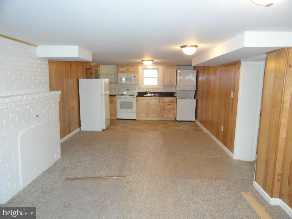 Large walk out basement efficiency apartment with newer cabinets with granite counter tops, Stove with over the stove microwave, Refrigerator, Stacked washer and dryer and a High efficiency heat pump providing both heat and air conditioning. Check out the floor plan of the unit. No Smoking, No Pets. Must be able to pass background and credit check.