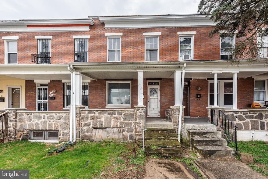 INVESTMENT OPPORTUNITY!  Spacious porch front rowhome with large room sizes!  Perfect opportunity to renovate and resell or fix up and add to your rental portfolio!  Main level with a living room, dining room, and kitchen, upper level with 2 bedrooms and 1 full bath, basement that can be finished to add more living space, and off street parking.  Sold As-Is!