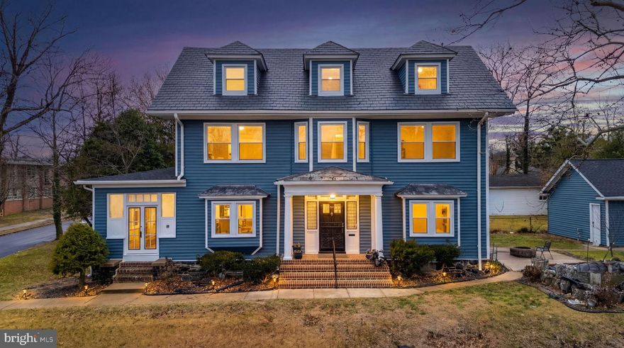 Set on a prominent corner lot, this expansive Colonial offers rare scale, character, and flexibility with over 3,600 square feet of above-grade living space across three finished levels.

Step inside to a welcoming foyer where hardwood floors, a mix of original and newer wood, run throughout the home. Fresh paint creates a bright, cohesive feel while preserving the home’s classic 1920s charm. The main living room is anchored by a dramatic two-story, wood-burning brick fireplace and tall ceilings, flowing easily into a generously sized formal dining room ideal for gatherings both large and small.

The kitchen has been refreshed with newly painted cabinets and new countertops, offering a clean, updated look while remaining well connected to the main living areas. Just beyond, the oversized sunroom is a true standout. Filled with natural light and offering views toward Lake Ashburton, this versatile space is large enough for a pool table, lounge seating, or a home office setup.

The second level features multiple spacious bedrooms and full baths, including one bedroom with balcony access. The third finished level adds even more flexibility with additional bedrooms and a full bath, perfect for guests, work-from-home needs, or multigenerational living. A partially finished basement provides bonus space, storage, and room to expand.

Outside, the detached garage includes a Tesla charging hookup, and the corner lot adds privacy and curb appeal. Additional highlights include new exterior siding this year, new roofing, and a smart-home touchscreen hub that controls lighting, outlets, and security cameras throughout the house.

A rare opportunity to own a truly large, character-filled home with modern updates in a sought-after setting.