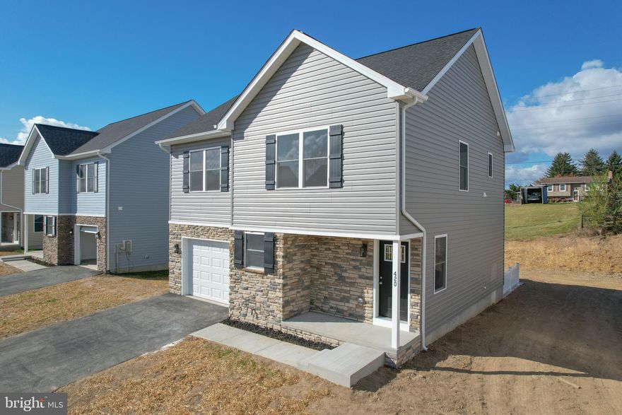 IMMEDIATE DELIVERY!!!!! Make brand new home ownership a reality! Tucked away on the edge of town, with NO HOA you'll find this gem! 3 bed, 2.5 bath new construction home with full basement and attached garage. Home is finished with luxury vinyl plank flooring on main level, stainless steel appliances, upgraded countertops, and upstairs laundry area. The primary suite features a walk in closet, double bowl sinks, and tiled shower. Public water and sewer, paved road, driveway, and sidewalk.