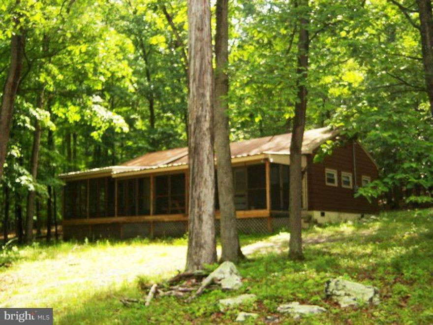 2.033 acres just removed from a much larger tract, with renovated 3 bedroom 2 bath cabin  with central air and heat , 200' of river frontage for your enjoyment.