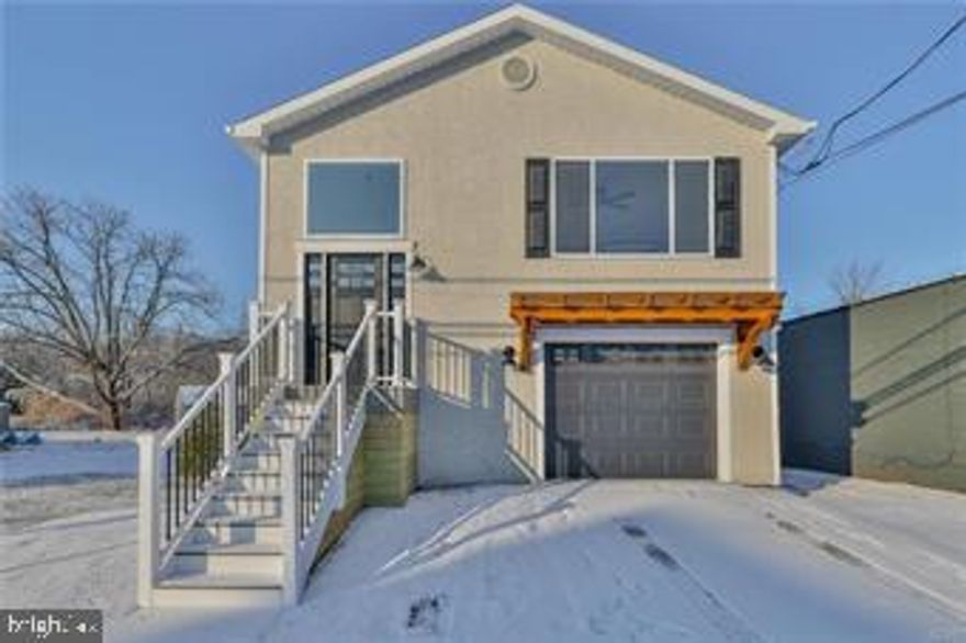 Newly remodeled 5-bedroom, 2 full bathroom craftsman style, split level home offers 1,925 sq. ft. of modern living space. Located adjacent to the Hellertown walking & biking path, nearby parks & fine restaurants. The home is located in a mixed zoning area, which may allow a home based business, professional space or in-law suite. As you enter the front door you will follow steps to the main level to an open concept kitchen by "American Woodwork", living room & dining area. The area expels warmth with additional country accents, a snack bar with a wood countertop for gathering, quartz countertops, farm sink, open shelves with shiplap back splash & new appliances, which leads to a craftsman style adjoining living & dining area. The hallway leads to three bedrooms & lovely full bathroom that connects to the master bedroom & is shared with the other two bedrooms. The lower level of the home has an additional family room with electric fireplace on a shiplap wall, two additional bedrooms, another full bathroom, laundry room that leads to a one car garage & utility room with a new hot water heater. The exterior has a new rear maintenance free deck with a view of the walking path & wooded area, new back yard fencing, new front entry deck, new entry doors, new a/c unit & new concrete driveway & sidewalk. Enjoy the convenient lifestyle this modern home offers in the lovely town of Hellertown. Home is located in the desirable Saucon Valley School district & close to I/78.