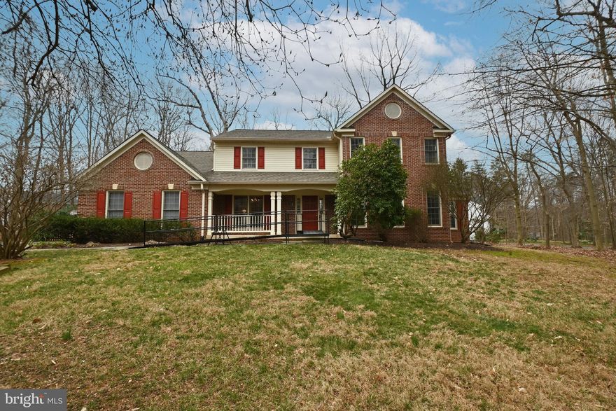 ***PRICE REDUCTION***
Welcome to this beautiful brick colonial located on 1.54 acres, near the end of a cul-de-sac with NO HOA! This 2-car garage, 5 bed room, 3 full bathroom, 1 half bathroom home is one you do not want to miss! 

Upon entering on the main level, the living room (or office space) is to the right and formal dining room to the left.  The eat-in kitchen has a pantry and opens to an expansive family room with a cozy fireplace for relaxing. Lots of natural sunlight from the oversized windows! Access the 2-car garage, driveway/outside entrance of home, as well as the main level laundry room from the kitchen. An amazing main level primary bedroom and primary bathroom (jacuzzi tub) provides additional living space on the first floor. This primary suite has a sitting area, walk in closet, as well as a exclusive deck and door leading to the backyard. 

Walk out to a private, partially fenced in backyard oasis! Beautifully landscaped with trees, and patio making it the perfect place to entertain! The 12x16 storage shed provides ample storage space for all your lawn equipment. In addition, there is an expansive front yard that is well maintained! 

The upper level has a second primary bedroom with primary bathroom, walk in closet and separate zone for heating/AC. The primary bathroom has a soaking tub and shower.  Additionally, There are 3 more large bedrooms and a full bathroom. There is a second stairway off the kitchen that leads to the upper level primary bedroom.  

The unfinished basement is over 1,200 square feet and ready for the new owners to add their finishing touch! There is a rough in for a full bathroom and some framing has been done to map out the rooms. Storage shelves convey with the home.  

Additional Items: Roof replaced within the past 5 years, Hot water heater replaced in 2018, Leaf guard protectors on gutters, Driveway recently sealed, and new garage code pad installed. 

**Wheelchair ramp conveys with home. If future buyer would like for it to be removed, it can be.  

Home Is located off of Minnieville Dr. close to Route 234 and I-95, making it perfect for commuting. Near shopping centers, restaurants, parks and many other entertainment options!