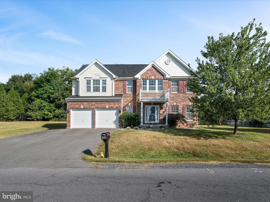 Well maintained 4BR/2.5BA colonial in the desirable McCauley Crossing community, conveniently located in Bunker Hill. This home offers plenty of space, many updates, and a hard to beat location. The main level features durable laminate flooring, a welcoming family room with gas fireplace, formal dining and sitting rooms, and a well-appointed kitchen with stainless steel appliances, tile backsplash, pantry, updated lighting, and breakfast nook. Upstairs, the spacious primary suite boasts vaulted ceilings, walk-in closet, and a deluxe en suite with dual vanities, soaking tub, and tiled shower. Three additional bedrooms and a full hall bath complete the upper level. The mostly finished basement adds even more flexibility with a rec/bonus room, office, potential 5th bedroom, and roughed in to add another bathroom. Recent updates include roof and HVAC (both <5 yrs) and resealed driveway. Convenient to schools, shopping, and commuter routes—this home is move-in ready and offers incredible value!