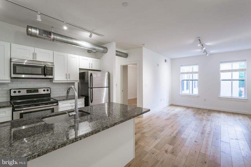 *Available Now!*

Modern Apartments for Rent in Old City Philadelphia Experience a thriving community and arts scene in Old City, Philadelphia. The Shirt Corner offers spacious, modern apartments with the subway and bus lines a half a block away, getting to Center City is a breeze. The Shirt Corner Apartments are located on the northeast corner of 3rd and Market streets in Old City Philadelphia. The “original” Shirt Corner, founded by Marvin Ginsberg in in 1960, was a retail store that sold men’s shirts. Amenities and features include Stainless Steel Appliances, Granite Counter Tops, Hardwood Floors, In-Unit Washer/dryers, Custom Tiled Bathrooms, Central Air/Heating, Elevator, Secured Entry, Fitness center, Bike Storage and Parking (additional fee )

Lease Terms: Generally, 1st month, and 1 month security deposit due at, or prior to, lease signing. Other terms may be required by Landlord such as last month’s rent upfront. $65 application fee per applicant. Tenants are responsible for: electricity, gas (if applicable), cable/internet and $10/mo technology fee. Water is metered by usage. Additional fees or requirements may be applicable for units with Homeowners or Condo Associations. Landlord Requirements: Applicants to make 3x the monthly rent in verifiable gross income, credit history to be considered, no evictions within the past 5 years, and must have a verifiable rental history with on-time rental payments. Exceptions to this criteria may exist under the law and will be considered. Cosigners will be considered.

*Pricing reflects the net effective rent after a 1-month credit is applied to a 12-month lease at $2,015/mo.
*Small pets permitted with owner approval; $350 non-refundable pet deposit, $50/month pet rent
*Photos are of a similar unit in the building, finishes will match, layout may differ
*Limited Parking Availability – Inquire with your Showing Agent for more info!