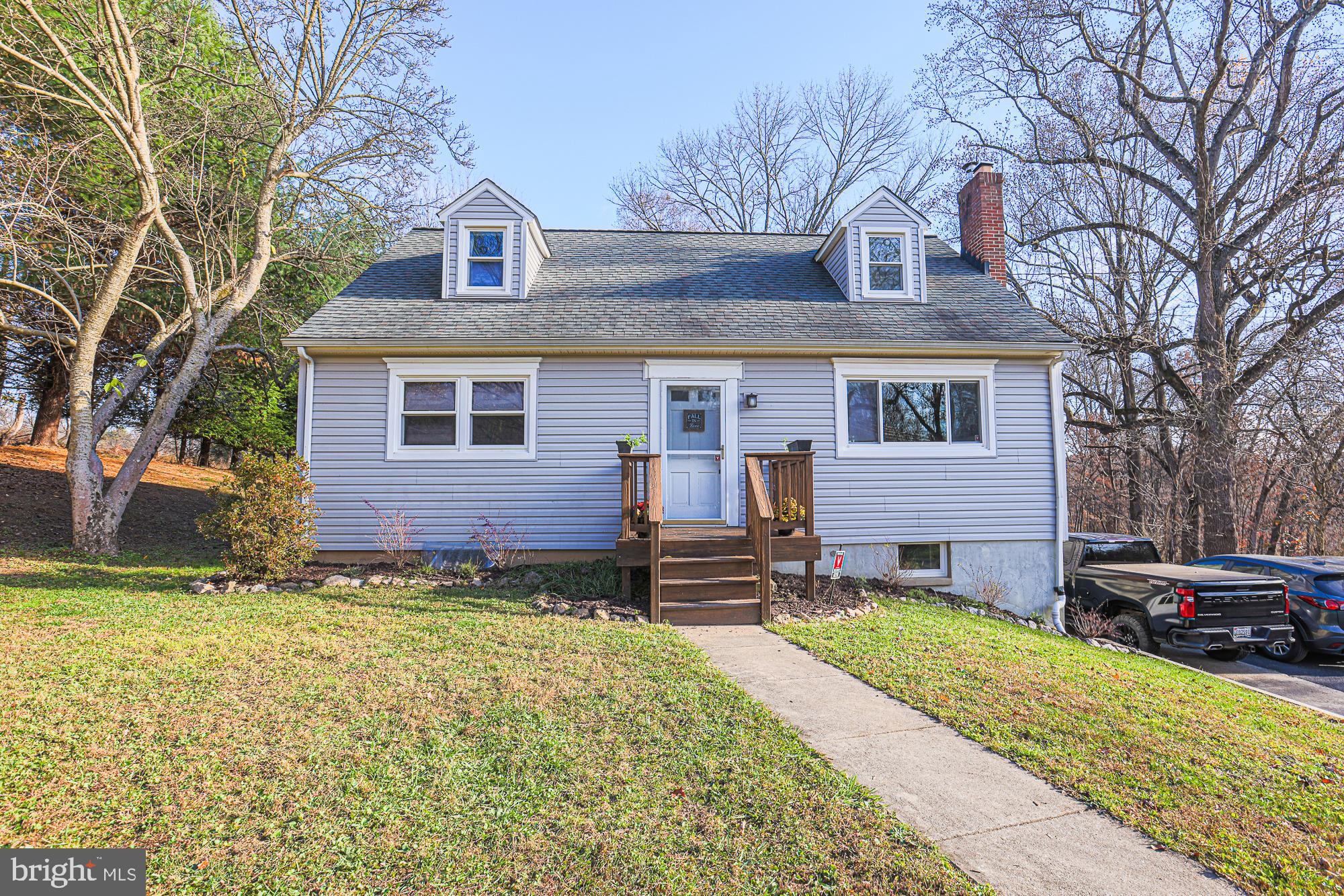 ***MULTIPLE OFFERS RECEIVED. HIGHEST AND BEST 11/14/2022 AT 5pm. Welcome to 8210 Dogwood Road! Just minutes away from Patapsco State Park, this four bedroom two full bathroom has so much to offer! Owners have made several updates such as; 2016 new septic system, new siding, new first floor doors, updated and painted shed outdoors and so much more. Upon entrance, you are warmly greeted by natural light pouring in, hardwood flooring throughout, a gorgeous white brick fireplace and an open floor plan seamlessly connecting the main living room to the kitchen. Meticulous attention to detail is presented in the gourmet kitchen with granite countertops, stainless steel appliances, freshly updated cabinets, updated light fixtures, a magnificent center island, and access to brand new deck outside. Two spacious bedrooms and one full bathroom finish the main level off just perfectly. Head upstairs and find the Primary bedroom, additional bedroom and fully remodeled full bathroom boasting with charm. Partially finished basement has been updated with new windows and new ceiling. Schedule a showing today!!
