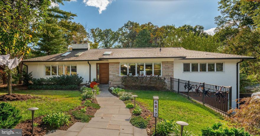 A rare find in popular Tulip Hill, this mid-century home has been beautifully updated and renovated by the current owners with stunning kitchen and baths, vaulted ceilings and a beautiful backyard. The main level features a gourmet eat-in kitchen with adjacent dining room, living room, family room, vaulted ceilings and 3 bedrooms and 2.5 baths, including a beautiful primary suite. The lower level offers full daylight walk-out to the private yard, A large rec room, 2 bedrooms, a full bathroom an abundance of storage and access to the two gar attached garage. Large flat backyard with patio and outdoor dining area, Winter river views from main level.

Tulip Hill is an amazing community of broad boulevards, neighborhood dog walks, and Front-Yard-Fridays.
Incredibly convenient location, just minutes to DC, Downtown Bethesda, Northern Virginia, the C&O Canal Trail, Potomac River, Capital Crescent Trail and great public and private schools.
Public Schools: Wood Acres Elementary, Pyle Middle, Walt Whitman H.S.