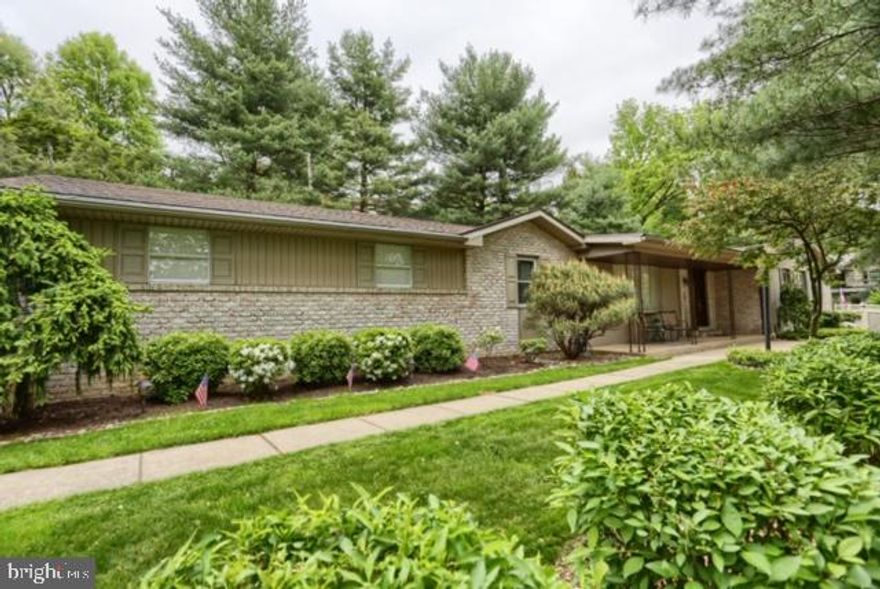 Private Paradise   Wyomissing Schools, 4 bedroom, 3.5 updated bathrooms, brick rancher snuggled on .65 wooded acre lot.  Kitchen with granite, stainless appliances.  Perfect floor plan for entertaining, formal dining room, New Holland stone fireplace, finished lower level (1,250. sq. ft.) with pool table and walk-out to in-ground pool, jacuzzi, gas heat & central air, summer fun awaits!  Neutral d cor.