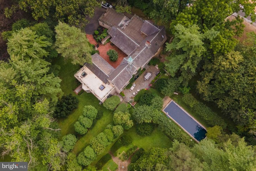 Welcome to "Au Vallon”: The luxurious estate that has it all. Just perfect for relaxing, working & entertaining! The modern Open Living spaces are seamlessly woven together w/ the more Trad/Formal rooms, providing the best of both worlds. Drive away from it all, through the entrance gates, onto the 2 private acres to discover this beautifully renovated and expanded, 200 year old Carriage House.  Enter the large, wooden, carriage doors to find the charming brick courtyard, surrounded by glass, allowing natural light to flood the interiors.  The charm and beauty of the original structure has been restored and enhanced and is coupled with the  substantial expansion of the main living areas, all to meet the requirements of today's most discerning buyers. All  rooms have views of the incredible grounds. An allee of clipped Linden trees form the perfect cover for dining, reminiscent of Provincial countryside.  The grounds feature specimen scattered throughout the property. Two large slate patios, multiple balconies & roof decks create more areas to enjoy the outdoors. The interior spaces are finished with exotic hardwoods, built-ins, 6 fireplaces, vaulted, beamed ceilings, large windows and antique doors. The 5 bedrooms, all of which have en suite baths & 3  bdrms feat. gas fireplaces & 4 bdrms have private balconies and/or decks.  All 4 have view of the spectacular grounds.  The formal front entrance brings you into the formal living room.  Crown & picture mldgs, built in shelving, a beautiful fireplace, lrg french windows & drs make this room truly special, not to mention the stunning pool, visible from the front door to give you and your guests that “wow” factor.  The bubbling fountain w/ sculpture provides the auditory ambiance to enhance the experience. The hidden opening to the dining room is behind the living room bookcase; always a surprise for guest.  Once inside, you’ll find the gas fp w/ gorgeous carved mantle & French doors that lead to the slate patio and the allee for entertaining.  The light-filled, wide open FAMILY ROOM feat. soaring ceilings, wood beams, gas fireplace, and french doors, all open to the informal dining area and newer Gourmet Country Kitchen w/ bar seating, granite countertops, 2 dishwashers, 2 SubZero's, a Wolf commercial range w/ pot filler and heated floors.  The adj., large, walk -in pantry, create sall the space needed to service the formal dining room & gourmet kitchen.  Just beyond the Family Room is a sep. side entr. w/ heated floors, a PR, mudroom w/ built-ins, a full laundry room area & access to the over-sized 2 car garage. On the other side of the family room, is the music area, open to both the courtyard and the formal wet bar, & a formal powder room to serve both of the formal spaces.  The 2nd wing of the 1st flr feat. a beautiful Library/Office  w/ built-in bookcases on 2 full walls, large french windows, & beveled glass french drs  leading to the 1st fl. wing w/2 large bedrooms, (often mistaken for the Main Bedroom) w/ gas frplcs, private balconies, story book windows, built- in shelves, & en suite seamless showers incl. 1 w/ soaking tub.The upper level feat. orig. wood paneled bedroom w/ renovated, en suite Mercer tile full bth. This bdrm feat. a lrg  deck w/ spectacular views. The Main Bedroom feat.  beamed clg., fireplace, storybook windows, &  Juliette balcony w/ stunning view of the POOL & the grounds.  The Main Bathroom is light- filled & feat. custom windows & skylights. This open space sets the stage for the freestanding Birthday tub flanked by a gas fireplace & the oversized, seamless shower that divides the room for 2 separate toilets, bidets & vanities.  This room also feat. a  full-sized cedar sauna, a lrg walk-in clt area & access to private deck!The The Daylight LL feat. the 5th en suite bdrm & Private Entr.; Perfect for visitors!  This flr also feat. another sauna, laundry , exercise area & access to Pool & Patios.  Agent related to Seller.