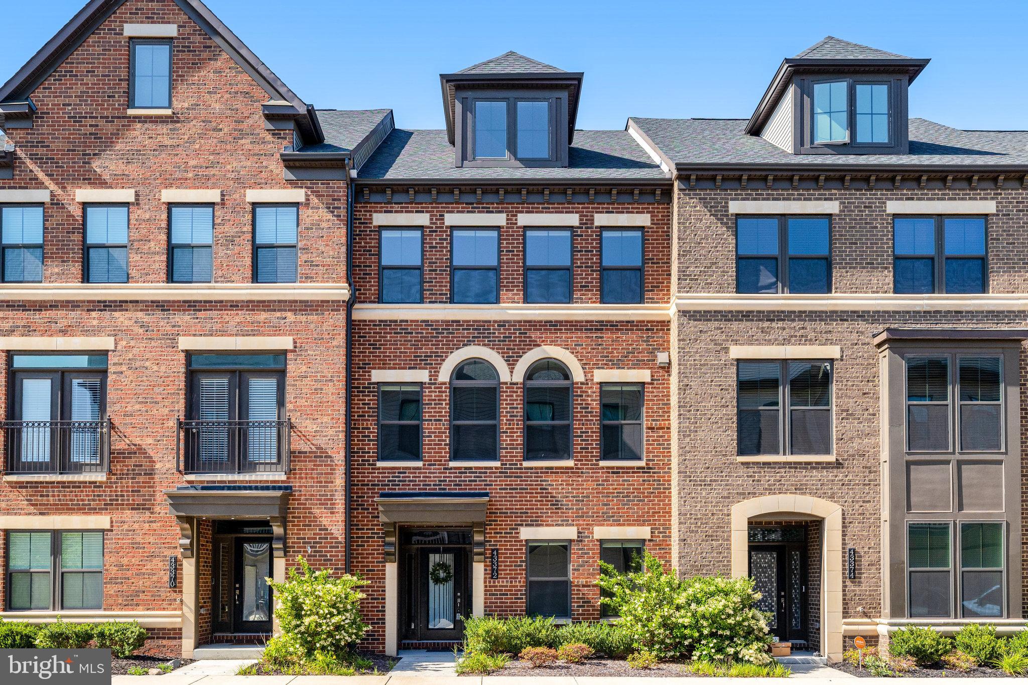 This brick-front beauty in sought-after Westmoore offers the perfect blend of style, space, and convenience. With 4 bedrooms, 3 full baths, 2 half baths, and a 2-car garage, you’ll have room for everyone and everything. Inside, the open-concept main level shines with hardwood floors, abundant natural light, and a showstopper kitchen featuring an oversized island, large pantry, and premium cabinetry, perfect for both everyday living and entertaining. Relax in the spacious living room or step out to the covered balcony for morning coffee. The entry level offers a versatile flex room. It's perfect for a home office, gym, or playroom—plus a convenient half bath and custom built-in storage off the garage. Upstairs, the luxurious primary suite provides two very spacious walk-in closets and a spa-like bath with soaking tub, large shower, and dual vanities. Two additional bedrooms share a stylish hall bath with double sinks. The top floor features a private bedroom and a full bath, plus a second flex space. It would be great as a media room, or a second office, and it gives you access to the rooftop terrace. Westmoore’s resort-style amenities include a pool, clubhouse, fitness center, lake, walking trails, playgrounds, and more—all just 1 mile from the Silver Line Metro and minutes to shopping, dining, and everything Loudoun County offers. Move-in ready, meticulously maintained, and designed for modern living—this home is ready to impress. Applications will be reviewed in the order that they are received, but please know that applications are not reviewed on weekends. Pets are on a case-by-case basis and there is a non-refundable $500 pet fee. All occupants age 18 or older are required to submit an application.