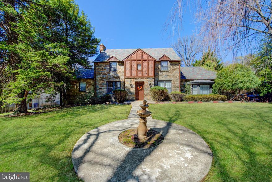 Tudor Elegance with Private Guest House!

Discover timeless sophistication in this stately Tudor-style residence nestled on a lush half-acre in the coveted East Falls neighborhood. Framed by classic stonework and mature landscaping, this exquisite estate blends historic charm with refined modern living.

At the heart of the property is a rare and elegant amenity—a fully appointed guest house seamlessly connected to the main residence. This private retreat offers a complete one-bedroom suite with a spacious living room, formal dining area, fully equipped kitchen, full bathroom, and its own washer and dryer. With direct interior access to the main house, it’s ideal for multigenerational living, an au pair, or luxurious long-term guests who desire both privacy and comfort

The main home exudes character with its stone façade, slate rooflines, and architectural details that speak to a bygone era. With its park-like setting, expansive grounds, and distinguished guest quarters, this East Falls estate offers a rare blend of grandeur, versatility, and charm.

As you arrive, the grandeur of original hardwood floors and stately architecture set the tone for what lies within. The main residence opens with a formal living room flooded with sunlight, a cozy family room for more intimate gatherings, and a gracious dining area set just off the light-filled, eat-in kitchen. Culinary enthusiasts will appreciate the light wood cabinetry, center island, gleaming stainless steel appliances—including a gas cooktop and double wall oven—and a large bay window that captures serene views of the expansive backyard. A sliding glass door off the kitchen extends your living space to a generous patio, ideal for entertaining or unwinding amid nature’s beauty.

The main level features two spacious bedrooms and a full bath with classic subway tile. Upstairs, three additional bedrooms and two full baths await—including a luxurious primary suite with a walk-in glass-enclosed stall shower, sleek subway tilework, and a peaceful ambiance.

The attached guest house is a rare treasure. Complete with its own entrance, it offers a full bedroom, formal living room, dining area, bright kitchen, and full bath with a walk-in shower. High-pitched ceilings and another sliding glass door create a light, airy retreat that opens directly onto the main patio—perfect for long-term guests or multigenerational living.

Outdoors, discover a secluded oasis with vibrant landscaping, tranquil views, and complete privacy. The three-car garage is complemented by a six-car driveway, making room for both convenience and celebration.

This is more than a home—it’s a lifestyle of timeless elegance, space, and natural beauty, all just minutes from Center City and the charm of East Falls village.

Just a 12-minute drive from Center City, this exceptional property is nestled in a quiet, serene neighborhood at the heart of recreational opportunities along the Schuylkill River, Wissahickon Creek, and Forbidden Drive. Enjoy the perfect blend of tranquility and convenience, with easy access to major highways including I-76, Route 1, City Avenue, Lincoln Drive, and Henry Avenue—all just moments away. The East Falls train station and nearby educational institutions such as Penn Charter, Germantown Friends, and Thomas Jefferson University add to the area’s appeal. This is a truly special property you won’t want to miss.