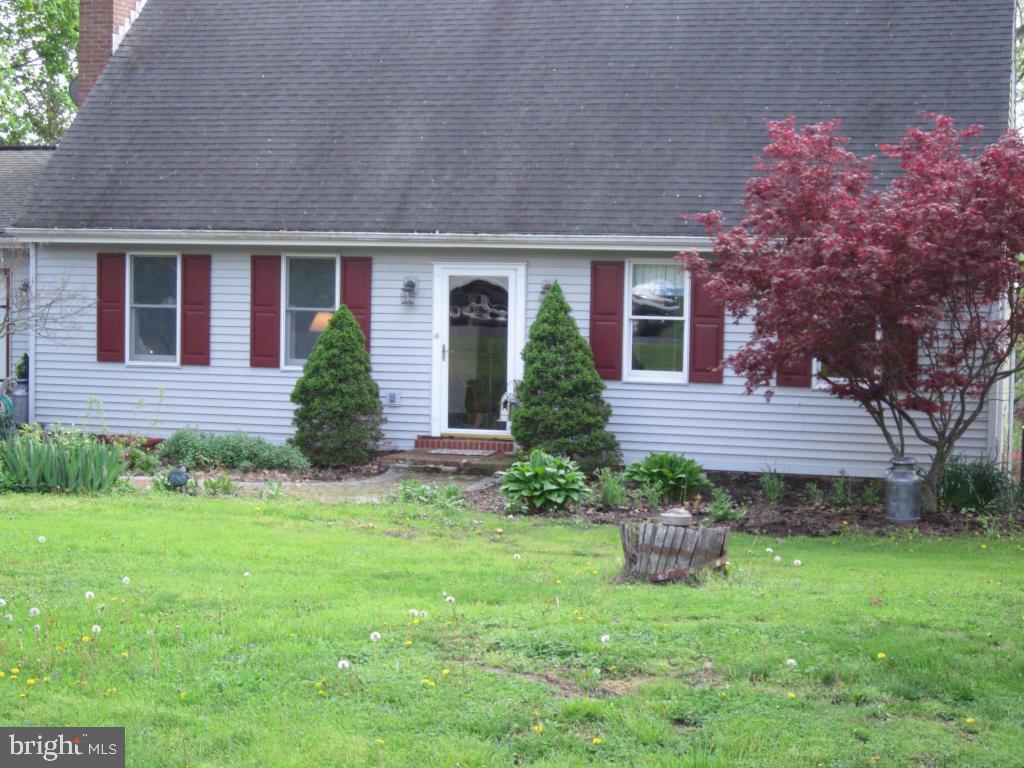 5 bedroom cape, walk out basement, large deck, creek frontage.