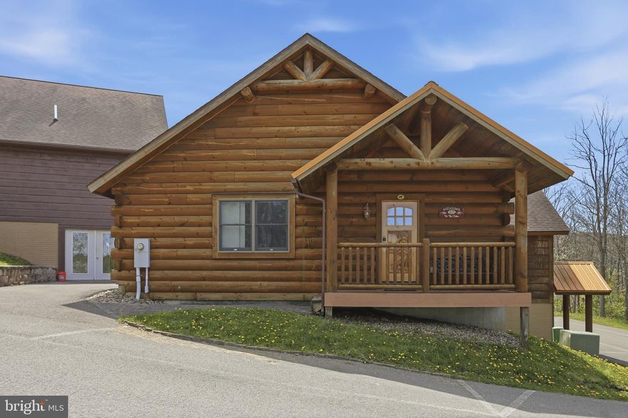 Cabin #47 at The Lodges of Sunset Village is a detached cabin that's an efficiency unit offers 2 beds plus a full bath and is approximately 576 square feet, and comes fully furnished and turnkey. This unit has a porch, patio and hot tub too! Rich in mountain character and charm, this log cabin features uniquely carved wood doors, beautiful beamed ceilings, warm wood walls, and inviting spaces that create an authentic lake and mountain retreat feel. Additional features include lake views, ski slope views, expansive decks, upgraded finishes, open concept living, stacked stone gas fireplace, open concept living, and a hot tub. Enjoy incredible views of Deep Creek Lake and Wisp, along with front row seats for seasonal beauty and memorable moments, including views of the annual July 4th fireworks. 

This property has a proven rental history, generating an average of  $36,658  in annual gross
rental income creating an exciting opportunity for
buyers seeking both personal enjoyment and investment potential. Experience one of Deep Creek Lake’s
newest ownership opportunities at The Lodges at Sunset Village. For the first time ever, fully furnished lake
area cabins are being offered for individual ownership in a breathtaking community featuring incredible lake
and Wisp ski slope views. Community amenities include lake access with 10 shared dock slips and an
impressive 1,320 square foot waterfront dock area perfect for fishing, swimming, launching kayaks,
relaxing by the water, and enjoying summer fun at the lake. Residents and guests also enjoy a lakeside
gazebo, playground, fire pit, gathering areas, pet-friendly accommodations, abundant parking, and on-site
professional management. The monthly condo fee provides exceptional convenience, including most
utilities, snow removal, trash service, and yard maintenance, for a low-maintenance ownership experience. Whether you're searching for a vacation retreat, income-producing investment, or both, The Lodges at
Sunset Village offers a rare opportunity to own at Deep Creek Lake. Stop by our on-site Sales Center at The Lodges Gatehouse during open hours to learn more, explore ownership opportunities, and get your questions answered: Thursdays 2:00–6:00 PM, Fridays 1:00–5:00 PM, Saturdays 10:00 AM–5:00 PM, and Sundays 10:00 AM–2:00 PM or call today for details and your private showing!
