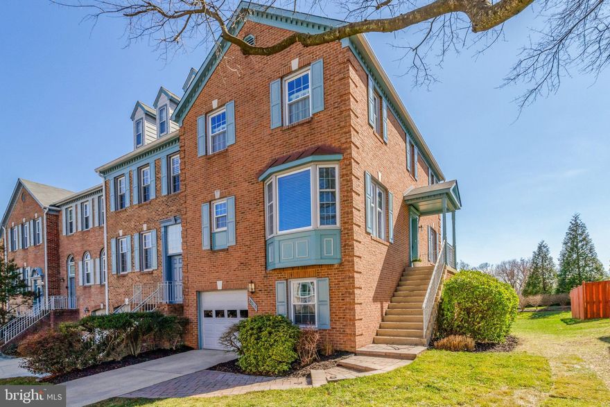 Fabulous end brick front and side Halle built garage townhome. Shows beautifully-move right in and enjoy. Spacious living room with gas fireplace, and walk out to rear deck overlooking common area and beautiful skies. Separate dining room. Updated kitchen with granite, stainless appliances (2022), recessed lighting, and open to large breakfast room with bay window. ALL hardwood floors on main level. Updated powder room. Upper level with oversized master bedroom with in  suite updated bath and walk in closet. 2 additional bedrooms share updated hall bath. Linen closet and attic. Enjoy the recroom on the lower level featuring 2nd gas fireplace, SGD walking out to brick patio, fenced and landscaped yard. Den and full bath complete the lower level. Updates include HVAC, HWH, roof, paint. windows, and baths. Will not disappoint!