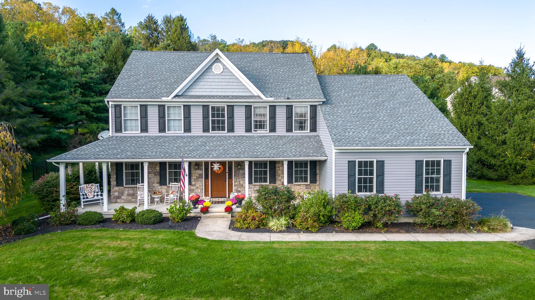 This stunning 4-bedroom, 2.5-bath home offers over 3,000 square feet of beautifully designed living space in the award-winning Palisades School District! The light-filled foyer welcomes you to a seamless, open-concept floor plan with gleaming hardwood floors throughout the main level. The heart of the home is the chef’s kitchen, featuring granite countertops, center island, and SS appliances. Nearby, a private home office, convenient half bath, and 1st floor laundry room with dog wash station add functionality. Upstairs, retreat to your spacious primary suite complete with a walk-in closet, ensuite bath, and bonus space perfect for a nursery, dressing room, or sitting area. Three additional bedrooms—each with generous closet space—and a full hall bath complete the second floor. The finished basement expands your living space with a 2nd family room and a separate flex room ideal for a playroom, office, or studio plus unfinished area ready for your home gym or extra storage needs. Enjoy the peaceful beauty of Bucks County from the large covered front porch, or unwind on the expansive rear deck overlooking a sprawling fenced yard—perfect for entertaining or relaxing in privacy. Additional features include a 3-car attached garage, large driveway with abundant parking, and a quiet one-road neighborhood just minutes from major routes, shopping, and dining. With space, style, and convenience, this home truly has it all!