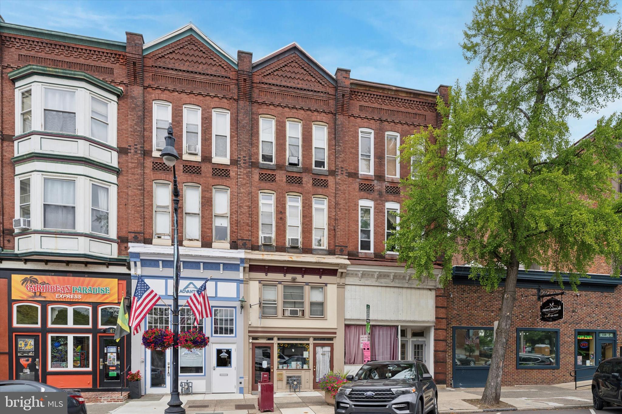 Join the momentum of downtown Pottstown’s revitalization with this fully rented four-story mixed-use property, well maintained and offering a strong investment opportunity with a net operating income of around $21,294. The first floor features a 1,600 sq ft commercial space with two off-street parking spaces, a main area with carpet and laminate flooring, kitchenette, half bath, and additional finished room. The second floor apartment is also about 1,600 sq ft with two bedrooms, a full bath, living room, and kitchen, while the third and fourth floor apartments are each approximately 1,000 sq ft, offering one bedroom, bath, living room, dining room, and kitchen; both updated within the past six years. The property generates about $35,000 annually with expenses of approximately $13,706 (gas $2,000, insurance $3,000, water/sewer/trash $3,000, taxes are $5,706). Sale includes 109 1/2 E High St (Bright will not accept fractions) and does not include 112 High St. The building consists of four units: one commercial on the first floor and three residential apartments above; with rents of $950 for the 1st floor, $1,400 for the 2nd floor, and approximately $1,000 each for the 3rd and 4th floors (status of 3rd and 4th to be confirmed). Electric and gas are separately metered, the owner covers water/sewer/trash as customary in Pottstown, and all rental licenses are current.