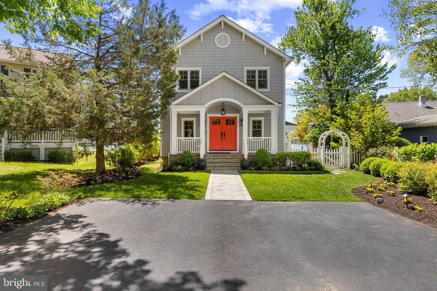 Experience refined waterfront living where thoughtful design meets effortless coastal elegance. Perfectly positioned on the shores of Back Creek, this exceptional residence offers a seamless blend of luxury, comfort, and lifestyle.

The main level is designed for both everyday living and elevated entertaining, featuring an open-concept layout anchored by a stunning chef’s kitchen with a large center island, custom white cabinetry, Bosch refrigerator, wall oven, gas cooktop with bronze hood, and a built-in bar. A butler’s pantry enhances functionality, while the adjoining living space is complete with a gas fireplace and designer tile flooring that mirrors the warmth of hardwood and creates an inviting yet sophisticated atmosphere. A powder room completes this level.

Upstairs, the primary suite is a true retreat. Soaring cathedral ceilings, shiplap detailing, hardwood floors, and a private balcony set the tone, while a gas fireplace adds warmth and ambiance. The spa-inspired ensuite bath features a soaking tub, walk-in shower, and clean, timeless finishes, complemented by two generous walk-in closets. This level also includes a beautifully appointed laundry room with custom tile and built-ins, along with a flexible open space ideal for a home office, gym, or lounge.

The lower level features a bedroom, a full bath, and an additional bonus room, providing flexible space ideal for family, guests, or a home office.

Outdoors, the property truly shines. Just steps from the water, a fully conditioned crab shack becomes your front-row seat to life on the creek; perfect for entertaining, unwinding, or simply taking in the view. The private shoreline features a large sandy beach, approximately 4 feet of mean low water, two boat lifts and two jet ski lifts.  A kayak storage system completes this backyard. The pier is outfitted with Trex decking, along with water and electric.

The grounds are meticulously landscaped with an underground irrigation system, complemented by a covered deck, outdoor shower, and storage shed. Additional features include Hardie Plank siding and a whole-house generator for peace of mind.

This is more than a home, it’s a turnkey waterfront lifestyle defined by quality, convenience, and understated luxury.