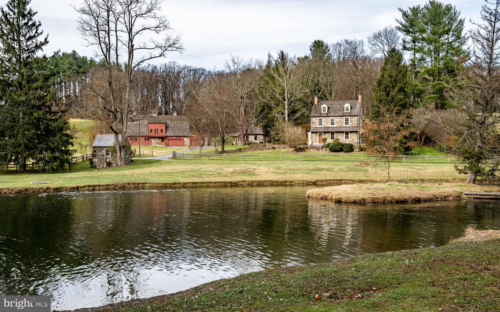 Set on one of the premier locations in sought-after Birmingham Township, sits Cannon Hill Farm with its classic c.1820 stone five bedroom farmhouse with three and a half updated baths. The farm boasts a cozy one-bedroom Guest/In-law Cottage with a bath & Kitchenette, a large barn with the loft area finished for large gatherings, and a newer barn designed by Archer & Buchanan that is suitable for numerous uses including a spacious home office with three garage spaces below. All of this is set on approximately 20 +/- park like acres. The home features two tiers of stone terraces and overlooks three idyllic, cascading ponds - a magnificent setting for a memorable party! The home's main level has a wonderful flow for a home of this vintage - all of the rooms can be easily entered and exited from several locations. Again, perfect for entertaining! The spacious kitchen has been updated with high-end appliances, granite countertops, and lots of cabinet space. Both the Kitchen and the Family Room have beautiful antique brick floors. Additionally, the Living Room, Dining Room, and Family Room all have working fireplaces. The Master Suite features a stunning Waterbury Designs Bathroom, large Bedroom, and a Walk-in Closet. There are four additional bedrooms on two levels, one of which has an en-suite bathroom. All of the mechanical systems for the home have been updated and the entire property has been very well maintained. Easily accessible to Route 100 and 202, commuting to Wilmington is easy! Additionally, you are only 30 minutes from the Philadelphia Airport and the King of Prussia/Valley Forge corporate area. A great bonus is the property's location in the highly desirable Unionville-Chadds Ford School District and the township's historic district. Cannon Hill Farm is set in a premier location, with incredible amenities, and will make a wonderful family farm for the discerning owner! This farm is truly a one-of-a-kind property and very well priced!
