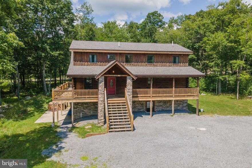 Located in the prestigious Greenbrier community on Lodestone Golf Course, this 6 bedroom, 5 full and 2 half bath home offers the perfect blend of luxury, comfort, and convenience. Just minutes from Wisp Resort and nestled in the heart of Deep Creek Lake, the property is a proven and successful vacation rental. Spread across three finished levels, the home features multiple ensuite bedrooms, two spacious living areas, a game room, gym space, and plenty of room to relax or entertain. Enjoy the enclosed back porch with an outdoor fireplace, or step outside to take advantage of the hot tub, horseshoe pit, fire pit, and more. Whether you're seeking a personal retreat or an investment opportunity, this home offers it all with upscale finishes, an unbeatable location, and access to year-round recreation right outside your door!