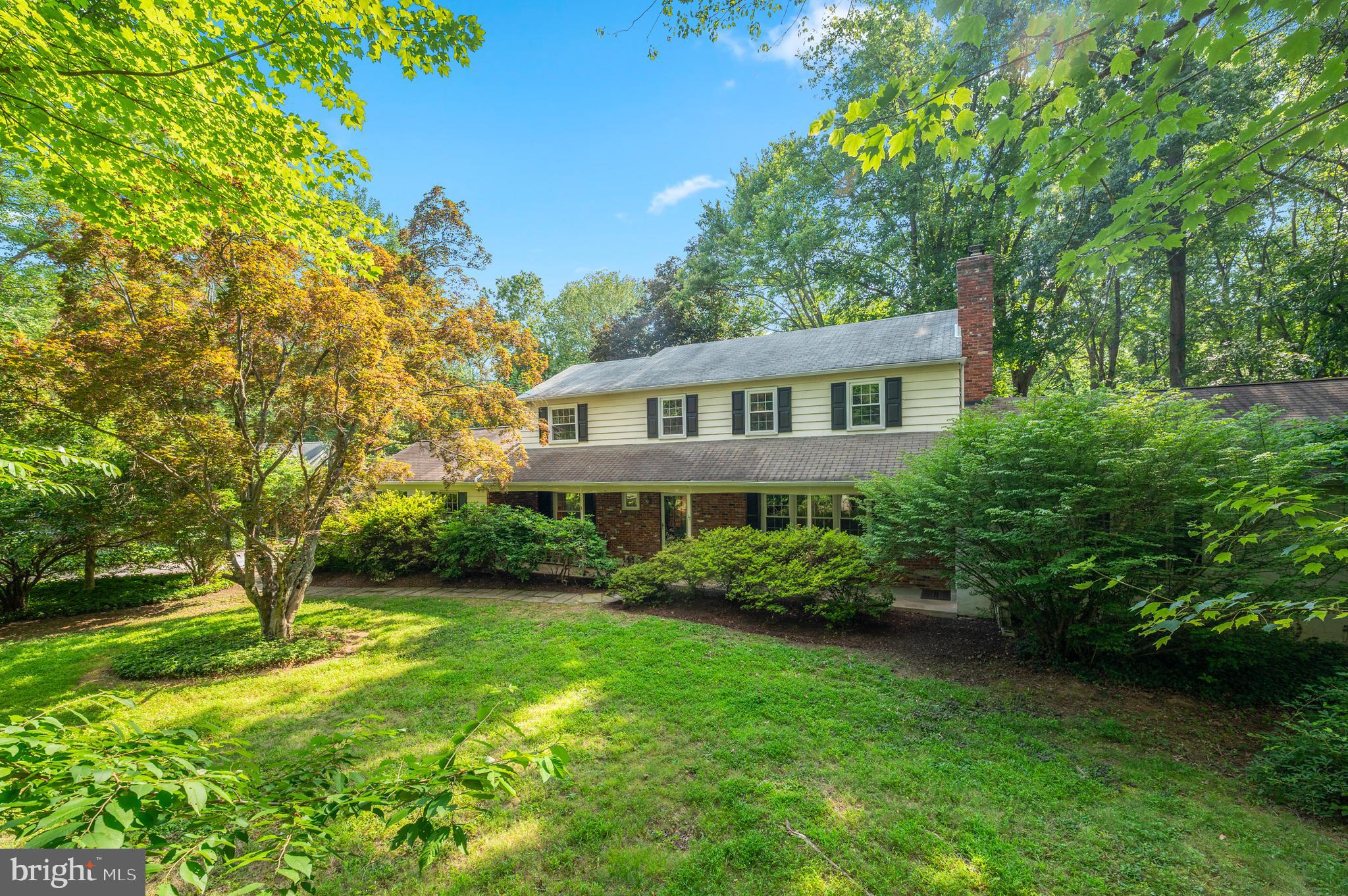Welcome to 1500 Sugartown Road—a private oasis in the heart of the Main Line in the award-winning Tredyffrin-Easttown School District offers a rare combination of privacy, space, and modern convenience just minutes from transit, dining, and shopping. Privately set on a flat flag lot, this timeless center-hall colonial is rich in character, featuring hardwood flooring, replacement windows, newer kitchen and new central air and a rare main level in-law or au pair suite with a private entrance offers exceptional flexibility.
At the heart of the home, a beautifully renovated open-concept kitchen impresses with custom cabinetry, gas cooking and abundant storage. The flow of the home is seamless with the front living room with wood-burning fireplace flowing to the kitchen/dining area which then connects to the oversized family room with wood-burning fireplace. From the family room access the in-law suite or the rear yard via a charming, covered porch. From the rear porch, enjoy serene views of the beautifully landscaped rear yard—an ideal setting for year-round gatherings of friends and family or watching the Waynesborough Country Club fireworks light up the night sky. The main level also offers a quiet den/sitting area, a conveniently located powder room, and inside access to an oversized garage with ample storage both on the level and overhead. Access the rear yard via sliders from the den, rear door off the drop zone, the dining room or the slider from the family room to the covered porch. On the upper bedroom level find the primary suite with two closets and a primary bathroom. Three additional bedrooms boast hardwoods, generous closets and access the bathroom. While the home has the privacy of the flag lot, the current owners loved camaraderie of the surrounding neighbors: there is a gate between their home and the neighbor on Waynesborough Road because the kids were so close, and there has always been a good rapport with the Sugartown neighbors to allow for overflow parking when guests were visiting. This home is as practical as it is beautiful.