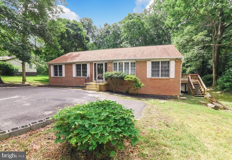 This home is so much larger than it appears!  The main level has new flooring and paint.  Three bedrooms and two full baths on the first floor.Basement is large with a huge game room complete with bar area, two bedrooms, full bath, large laundry area, workshop and another living room. Large back deck makes for a great place to entertain!  Backing to trees gives the backyard more privacy.This floorpan is so open the possibilities are many!  Not deep into CRE with easy access out.  Location is key for no worries during winter as the owner says he has never been stuck due to the road always being plowed the fastest!