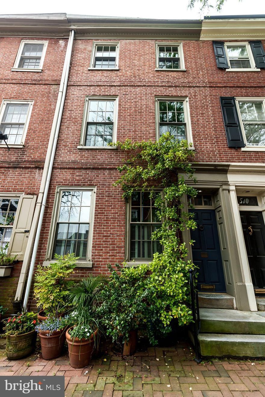 Welcome to 508 Delancey St. Located on one of the finest and most sought-after beautiful tree line blocks in the City of Philadelphia- Society Hill neighborhood.  508 Delancey St. is a beautiful 3.5 story Federal Period Home boasting 5 bedrooms, 2.5 baths and a lot spanning 68 feet deep with over 2400 square foot of living space. Abundant amount of natural light, high ceilings, gorgeous original random width pine floors throughout, 4 fireplaces, eat in kitchen, den/sitting room plus an unbelievable bi level brick garden with lots of mature trees and direct access from both the living room and kitchen area. 1st Level:  Picturesque red brick front with a restored period correct paneled front door and surrounds, framed by climbing Euonymus evergreen shrub introduces you to the main level.  A quiet and peaceful sitting room with free standing coat closet and leading to a rear living room with wood burning fireplace overlooking the beautiful garden. Lower Level:  Original 5 level cherry handrail staircase leads down to a double height den/dining room with wood burning fireplace plus an entire wall of custom built in bookshelves enclosed by wood paneled doors for storage. The Dining area flows directly to a light filled bright eat in kitchen with good cabinet space, high end appliances and an expansive sliding glass door opening onto the large secluded bilevel mature garden with a Japanese Red Maple providing Summer shade and two Winter blooming Camellia trees.  Brick paved garden seating area and 15 linear ft. of Lattice doors for hidden garden storage.  A true private oasis - you must see it to believe it.  This level also has a large powder room and a walk-in pantry room with lots of shelving. 2nd Level:  Generous sized front bedroom overlooking beautiful Delancey Street with original pine flooring, custom closets with rollouts and a non-working fireplace with original circa 1804 wood mantel and Moravian tiles. The spacious hall area has a spa like bath with seamless glass shower, linen closet and a laundry area with side-by-side Asko Washer/Dryer. Light filled rear bedroom with wonderful southern exposure, an entire wall of bookshelves, closet and overlooking the beautiful private garden.  3rd Level: Beautiful front bedroom with wide plank flooring, non-working fireplace with circa 1804 wood mantel and handmade Moravian tiles.  Full spa bath with seamless glass and a soaking tub.  Rear sundrenched bedroom/office with a sizable closet and custom-built ins.  4th Level:  Large skylight providing wonderful natural light introduces you to the next level – where you will find 2 Bonus rooms with cathedral ceilings and exposed wood beams. This level could be perfect for a 5th bedroom, family room, gym, playroom, or a work from home office.  There is also extra attic storage above this floor.  About the neighborhood – Society Hill – Simply the best!  With many historic parks, playgrounds, schools, restaurants, cafés and much more. Within walking distance of Center City. Easy access to all major highways and bridges.   Properties on this street are rarely offered.  Schedule your appointment today!