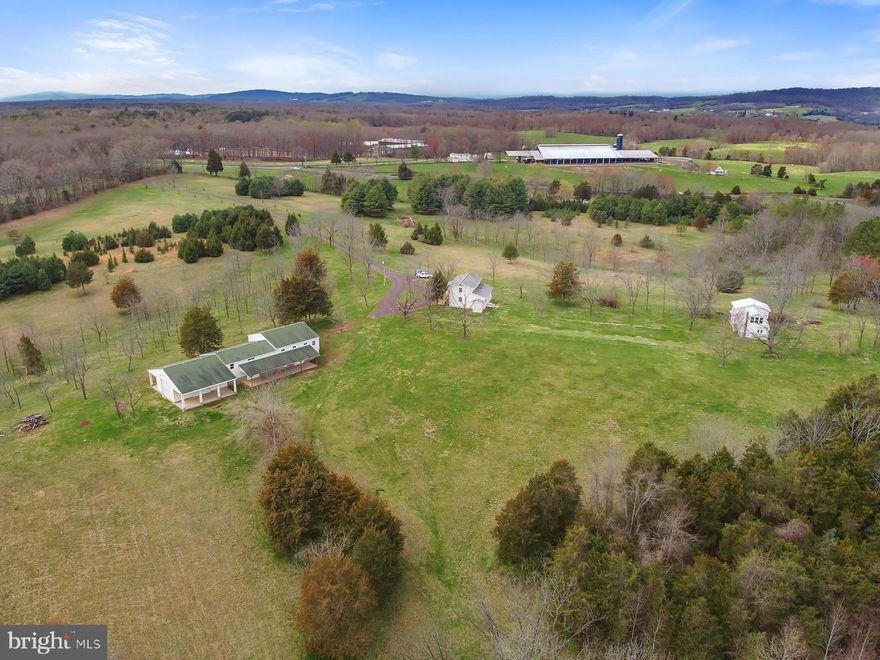 109+ Beautiful rolling acres of limitless opportunity. This black walnut tree farm has been meticulously maintained and cared for. Partially wooded with lots of cleared areas throughout the acreage. Over 1000 mature black walnut trees and a natural stream running through the property.  Also, used to be a former local Christmas tree farm. Main house includes bright sun room, large kitchen with dining area open to the family room, 4 bedrooms, 3 full baths and a laundry room all sparkling clean and move in ready.  The dutch barn includes a great hobby/workshop area with full bath and washer & dryer on the main level. Upstairs has a great efficiency living quarters with kitchenette. 3rd Building, huge (108' x 35') heated and cooled workshop, garage and equipment room with 3  bays. Tons of extra room for storage or additional work space! Lots of possibilities here! 2 tax maps in this sale. A family member has the right to buy on or before April 6,2020.