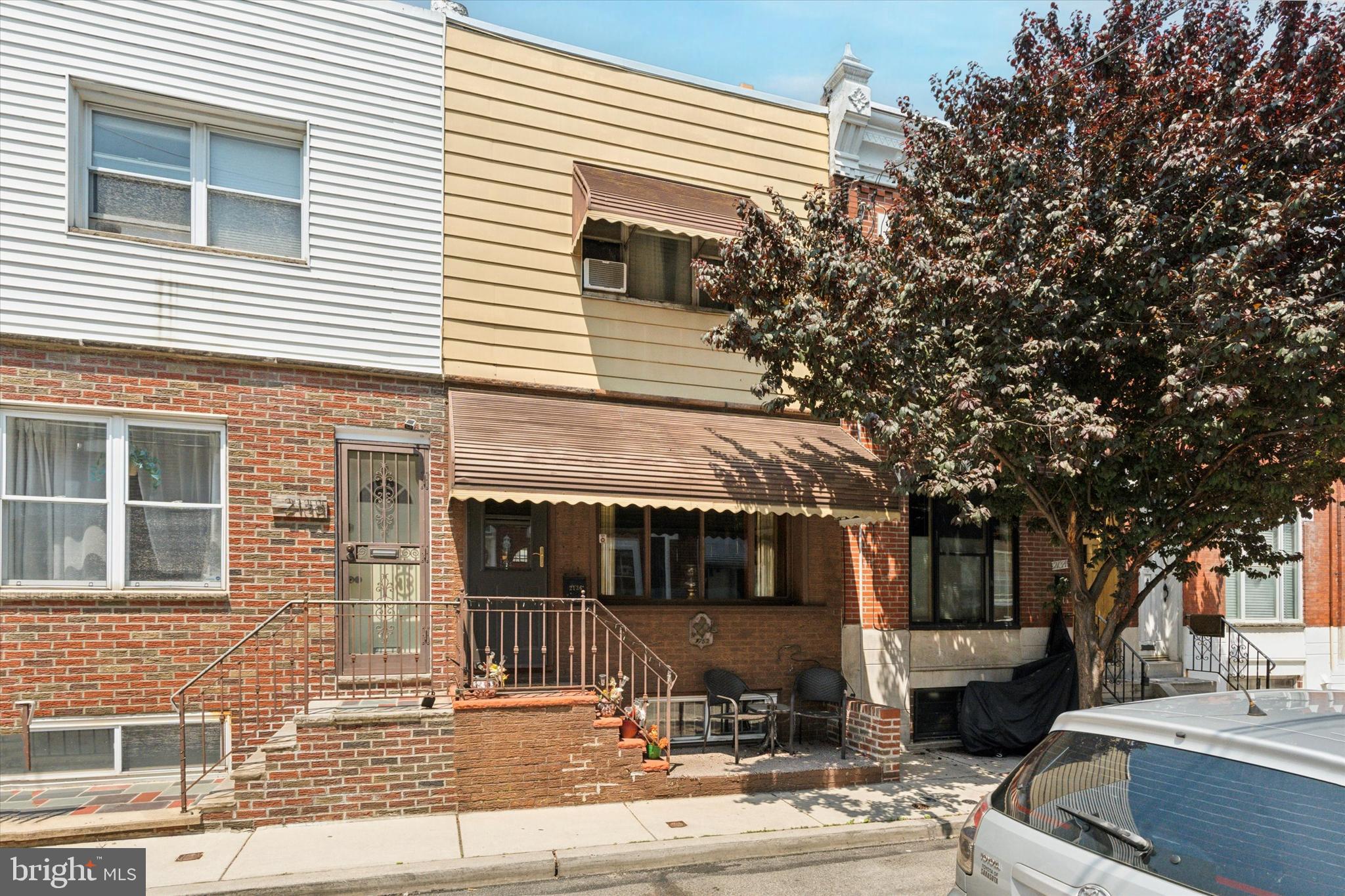 Welcome to 2136 S. Mole Street – a charming rowhome tucked away on a quiet block in the heart of South Philadelphia! This lovingly maintained home blends classic South Philly Chic with standout woodwork and custom details throughout. From the moment you enter, you'll notice the warm, inviting atmosphere created by original hardwood floors, rich wood trim, and unique custom-built features that give the space a one-of-a-kind feel.
The entrance immediately prepares you for the adventure to come, with a 1 foot deep custom wood breezeway and front door into this time capsule. The main floor offers a spacious living and dining area with timeless charm, including an exposed beam ceiling, wood trimmed bay window and original hardwood floors ready to be exposed. The kitchen combines function and personality, with rarely seen archways, patterned paneling, a gothic style window, and an incredible Dutch door to the rear patio.
Upstairs, you'll find two well-sized bedrooms with deep closets, hardwood floors, and more of the distinctive wood touches that set this home apart.
The basement of this Nonna special may be its greatest feature, highlighted by its sitting room and Sunday gravy kitchen! Tucked away you'll also find a rear laundry room, half-bath, and relatively new and well-maintained mechanical systems.
Located just steps from Passyunk Avenue, neighborhood parks, and local favorites, this home offers both charm and convenience in one of Philly’s most beloved neighborhoods. Don’t miss the opportunity to own a truly unique South Philly gem!