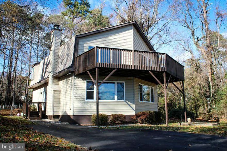 Enjoy laying on the beach, just one of the wonderful amenities with purchasing this great investment.  Septic to be replaced prior to close by seller!  Unique floor plan of 2 B/R's  & 1 full bath,  family room, kitchen and dining room.  Fireplace, balcony, stunning views of the Chesapeake Bay, level lot, fenced rear yard, shed, boat ramp included in HOA's!