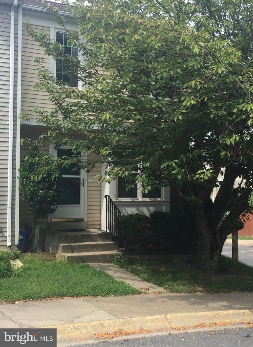 3 Level End Unit, 3 Bedroom, 3 Bath, Newer Kitchen, Hardwood Floors, Large fenced in yard. Painting in progress.