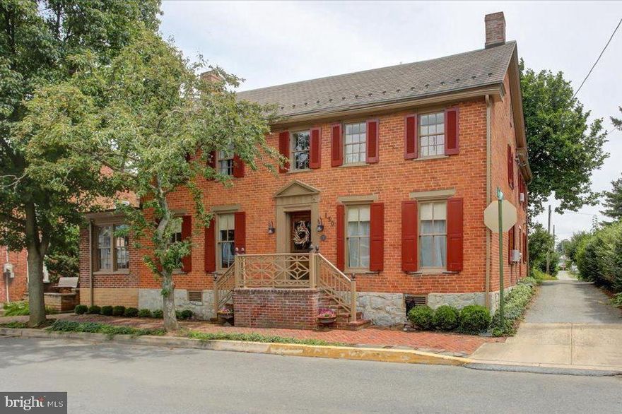OLD WORLD CHARMER!  Vintage brick 2 story home with tons of charm & character!  Updates include kitchen, 1 1/2 baths added on main level, 200 AMP electric service w/updated wiring, enclosed 3 season room/sun room, laundry/mud room on main level, exterior recently painted, recently paved off-street parking next to classic carriage garage in rear and an absolutely stunning backyard w/beautiful landscaping.  The charm starts at the front door, check out the classic door bell, and continues throughout w/wood floors, large LR w/built-ins, decorative coal fireplace and full length glass window/door that looks out through sunroom into a private and peaceful backyard.  Home offers 3 bdrms and full bath on 2nd level, and possible 4th bdrm and 1 1/2 baths on main level.  Currently 4th bdrm is being used as an office.  Great in-town location within walking distance of downtown shops and school complex.  If you are looking for old-time charm that's in move-in condition, this is it!