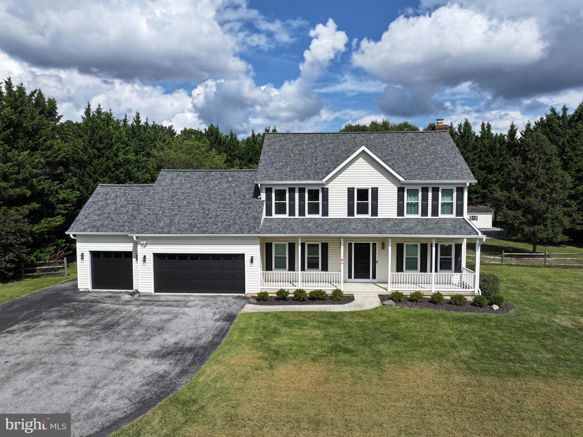 Welcome to this beautifully renovated Victorian-style Colonial, perfectly situated near the end of a quiet cul-de-sac in one of Carroll County’s most sought-after subdivisions.
Set on a level 1.63-acre lot, this home has been thoughtfully updated with more than $60,000 in improvements, including a brand-new roof, fresh paint, luxury vinyl plank flooring on all three levels, and a completely redesigned kitchen.
The main level features a dramatic two-story foyer, 9-foot ceilings, spacious formal living and dining rooms, and a gorgeous new kitchen with 42" white cabinetry, quartz countertops, stainless steel appliances, a center island with microwave base cabinet, and a modern open flow to the family room with a decorative fireplace. From the breakfast area, sliding glass doors open to a Trex-style deck and private rear yard—perfect for morning coffee, summer barbecues, or simply unwinding in nature. A convenient laundry room and oversized three-car garage complete this level.
Upstairs, the expansive primary suite offers a walk-in closet and spa-inspired bath, accompanied by three additional bedrooms and a full hall bath.
The fully finished lower level is designed for entertaining and everyday living, featuring a spacious recreation room with new LVP flooring, recessed lighting, a full bath, freshly painted walls, generous storage, a utility room, and a walkout to the side/rear yard.
With three finished levels, modern upgrades, and abundant space both indoors and out, this move-in ready home is perfect for hosting gatherings, entertaining friends and family, or simply enjoying a comfortable lifestyle. A true blend of charm, function, and style—this is the home you’ve been waiting for.