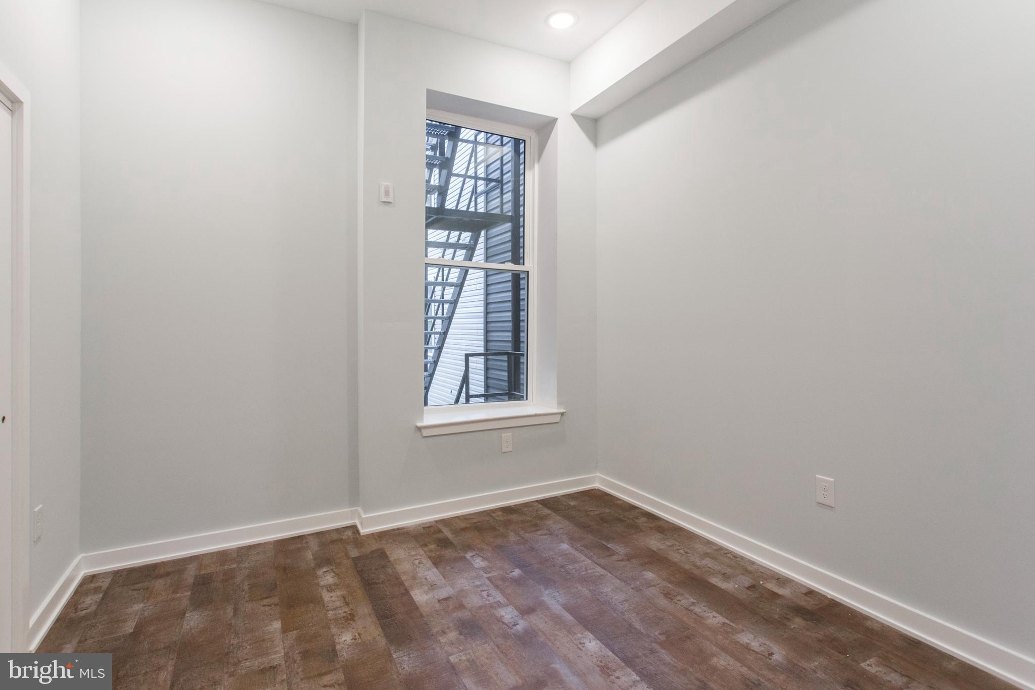 Welcome to 1318 S Broad Street, Unit 2F—a beautifully updated 1-bedroom, 1-bath apartment in the heart of South Philadelphia. This modern residence offers comfort, style, and unbeatable convenience just steps from the Broad Street Line, Columbus Park, grocery stores, and some of the city’s best dining spots.
Inside, you'll find gorgeous flooring throughout and a bright, open layout. The sleek, contemporary kitchen features crisp white cabinetry, stunning countertops, stainless steel appliances, a gas stove, and a center island that adds both prep space and functionality. The spacious living area is perfect for relaxing or entertaining.
The bedroom offers comfort and privacy, while the modern bathroom and in-unit stacked washer and dryer add everyday convenience.
One of the standout features of this apartment is access to a shared roof deck with sweeping views of the Philadelphia skyline—a perfect place to unwind or entertain.
This is city living at its finest with modern amenities and a central location that makes commuting and exploring Philadelphia a breeze.