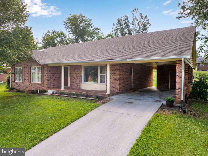 Spacious All-Brick Ranch in Sought-After Front Royal Neighborhood!     
This beautifully built brick ranch-style home sits in one of Front Royal’s most desirable neighbors—just minutes from schools, shopping, and medical facilities.  With new architectural shingles, a brand new heat pump system, new water heater, and new kitchen appliances, many major updates are already done for you!  Inside, you’ll find refinished oak hardwood floors throughout the main level and four generous bedrooms, including a primary suite with a private bathroom. The original vintage-style bathrooms add charm and character, ready for your personal touch.   Enjoy a covered front porch, a flat backyard, and an attached carport that could easily be enclosed to create a garage. The fully finished basement features a massive family/rec room with a brick fireplace and a built-in sink cabinet—perfect for entertaining or creating a secondary kitchen/bar area. The lower level also includes a large laundry room and a convenient half bath.   This well-built home offers solid bones and timeless quality—just waiting for your final touches to make it your own!
