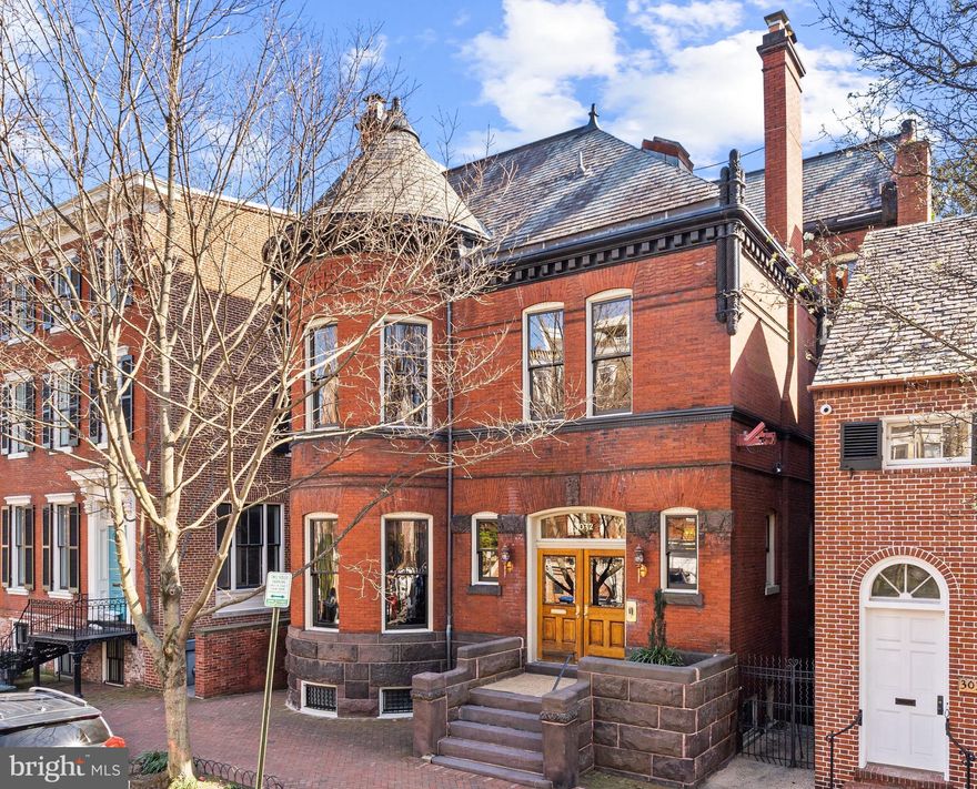 The property on which the current 3032 N Stands today is one of the oldest residential lots in Georgetown. The house was constructed circa 1891. This impressive estate presents an unparalleled blend of historical significance and architectural grandeur. The property stands as a testament to both exquisite craftsmanship and timeless elegance, boasting exceptional scale that is rarely available in Georgetown. Upon entering, guests are greeted by a grand foyer that sets the tone for the rest of the home. The formal floor plan showcases dignified entertaining rooms, each radiating sophistication and grace. These spaces are adorned with intricate moldings, nearly 12’ ceilings, and ornate details that harken back to an era of refined living. The foyer seamlessly transitions to the sophisticated formal living room, enhanced with an elegant fireplace that serves as the room's centerpiece. Adjacent to the living room, the beautiful music room offers an additional fireplace and access to the impressive dining room. The banquet-sized dining room is a testament to luxury entertaining, comfortably accommodating large gatherings. The room is richly appointed and has an additional fireplace. Towards the back of the home, the gourmet kitchen is expansive and combines functionality with comfort. There is a large center island, abundant cabinetry storage, and high-end appliances. The kitchen opens to the breakfast area/family room, where large windows let in wonderful natural sunlight and provide a beautiful view of the outdoors. Glass paneled doors from this room directly access the rear deck and garden, which is ideal for entertaining. There is also the added convenience of a butler's pantry, powder room, and the elevator that accesses all floors. Upstairs, the private quarters are equally as impressive, with spacious bedrooms illuminated by abundant natural sunlight. The second level offers three bedrooms, including the luxurious primary suite. The primary suite is expansive and elegantly appointed with two fireplaces, two walk-in closets, and a private covered deck, accessible only from the suite itself. There is a magnificent en-suite bathroom, which features dual vanities, a large soaking tub, and a walk-in shower with multiple shower heads, offering a spa-like experience. There are two additional bedrooms on this floor, both with fireplaces and wonderful sunlight, as well as a sizable office with a fireplace, and a hall bathroom. The top floor has two additional bedrooms, one with a private en-suite bathroom and the other with access to an oversized turreted play room. Additionally, a TV/sitting room on this floor directly accesses the rear deck. Stairs from the deck lead to an additional entertaining area with incredible panoramic views of Washington. There is also a kitchenette, washer and dryer, and hall bathroom on this level. The lower level of the residence is expansive with a staff suite, laundry, and storage. Additionally, there are two stand-alone guest and/or staff suites. Outside, the grounds are exceptionally private and meticulously landscaped, featuring manicured gardens, mature trees, and multiple terraces spaces to extend entertaining opportunities to the outdoors. There is also multi-car surface parking in the rear of the property. With a history as rich and captivating as its design, the residence offers a unique opportunity to own one of Georgetown’s great architectural masterpieces.