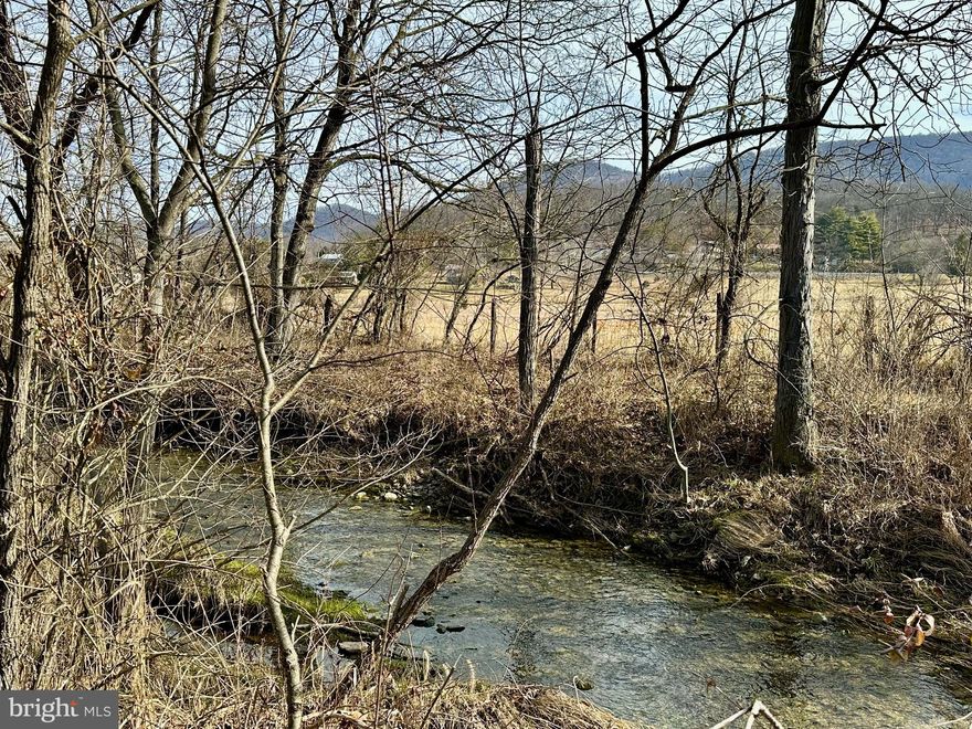 Dreaming of your own farmette? Come check out this gorgeous lot! Featuring 11+ Unrestricted acres and a 3-bedroom perc. The entire Eastern side of the property offers a lovely, flowing stream. Most of the land is cleared field/pasture perfect for farming, and the rear, West corner of the property gently grades uphill to an  elevated homesite with fantastic views of the rest of property and farms and mountains in the distance. You have to see and walk this property so really take in all it has to offer!