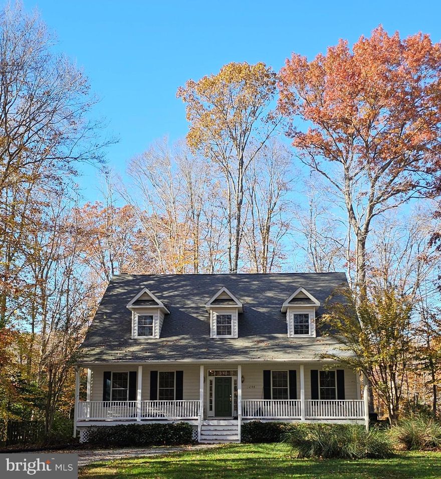 Live close enough to commute with ease—yet far enough to truly unwind—this private Cape Cod offers the best of both worlds near DC, Annapolis, and Andrews AFB.

Set on a private, wooded lot with open space across the street, this home delivers a sense of peace and separation from the pace of the city—without sacrificing convenience.

Inside, the layout is both functional and inviting. The main level features a formal living room and dining room, complemented by a warm and welcoming keeping room with a fireplace just off the kitchen—perfect for gathering. Just off the keeping room, a large pantry adds exceptional storage and convenience. A bright breakfast nook and spacious family room provide additional living space, along with a convenient half bath.

Upstairs, you’ll find three generously sized bedrooms—each with its own private bathroom—offering comfort, privacy, and flexibility for guests or multi-generational living.

The unfinished basement provides ample storage and future potential, complete with a walkout exit, laundry area, and Culligan water system already in place.

Outdoor living is where this home truly shines. A full-length front porch invites you to slow down and unwind, while the covered back porch overlooks a serene wooded backdrop—your own private escape at the end of the day.

With no HOA, a peaceful setting, and a location that keeps you connected to major commuter routes, this home offers the best of both worlds: quiet living with easy access to everything.