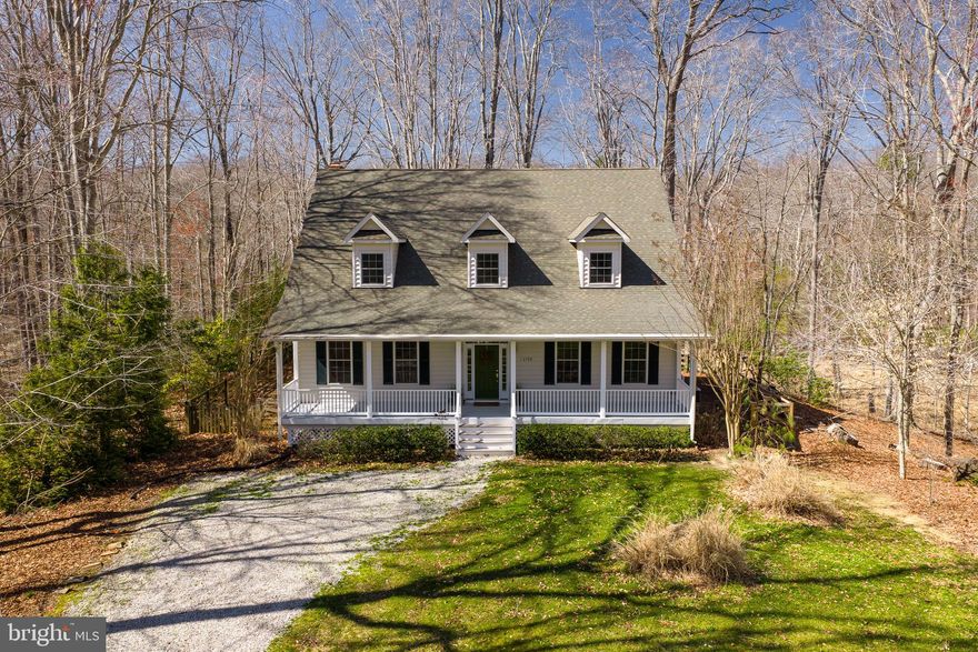 Live close enough to commute with ease—yet far enough to truly unwind—this private Cape Cod offers the best of both worlds near DC, Annapolis, and Andrews AFB.

Set on a private, wooded lot with open space across the street, this home delivers a sense of peace and separation from the pace of the city—without sacrificing convenience.

Inside, the layout is both functional and inviting. The main level features a formal living room and dining room, complemented by a warm and welcoming keeping room with a fireplace just off the kitchen—perfect for gathering. Just off the keeping room, a large pantry adds exceptional storage and convenience. A bright breakfast nook and spacious family room provide additional living space, along with a convenient half bath.

Upstairs, you’ll find three generously sized bedrooms—each with its own private bathroom—offering comfort, privacy, and flexibility for guests or multi-generational living.

The unfinished basement provides ample storage and future potential, complete with a walkout exit, laundry area, and Culligan water system already in place.

Outdoor living is where this home truly shines. A full-length front porch invites you to slow down and unwind, while the covered back porch overlooks a serene wooded backdrop—your own private escape at the end of the day.

With no HOA, a peaceful setting, and a location that keeps you connected to major commuter routes, this home offers the best of both worlds: quiet living with easy access to everything.