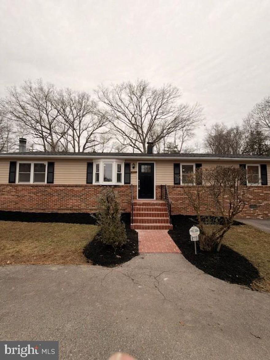 This Beautifully Updated Home Boasts an Open-Concept Kitchen with Brand-New Cabinets, Stunning Quartz Countertops, Sleek Tile Backsplash, and Stainless Steel Appliances. The Modern Updates Continue Throughout, Including Fully Renovated Bathrooms, New Flooring, and Stylish New Lighting.  Enjoy Spacious Bedrooms and Cozy Evenings by the Fireplace. Step Outside onto the Expansive Deck, Perfect For Entertaining or Relaxing in Privacy. The Detached 2-Car Garage adds Convenience and Additional Storage. Located on Nearly an Acre of Land, this Home Combines Modern Comfort with Serene Country Living. Don't Miss This Move-In Ready Gem!