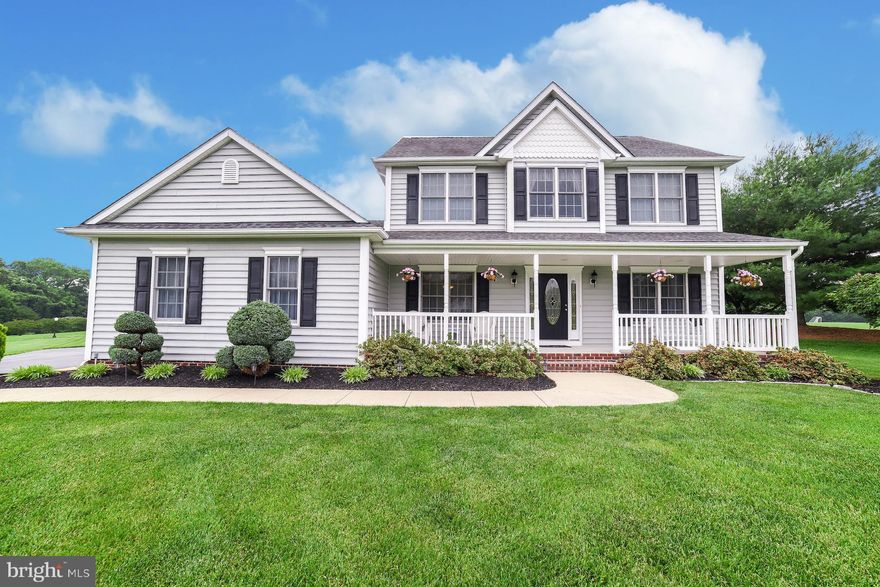 Delightful farmhouse-style colonial with wide front porch, lovely landscaping! Attractive KT w/cherry-stain cabinets, granite, stainless appl's inc dbl oven, gas cooktop, built-in mic; FR w/gas FP, TV & Bose speakers convey! MBR w/WIC & bath w/jet tub, sep shower. Laundry/mudroom, deck, 2-car gar w/wrkshp; 30-yr arch shingles, dual zone ht pump w/gas b-up. Quiet Hollywood neighborhood, 1-acre lot!