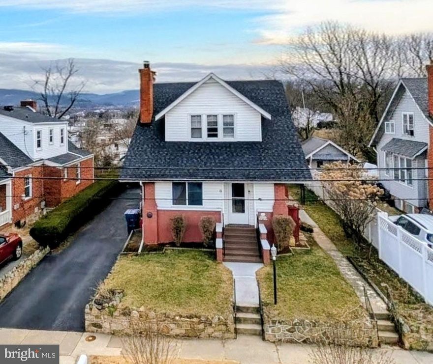 Charming Cape Cod with Modern Updates, Stunning Views & Incredible Versatility!
Step into timeless character meets contemporary comfort in this beautifully updated 4-bedroom, 3-full-bath 1930s Cape Cod, ideally located just minutes from I-66, top-rated schools, and convenient shopping. Rich hardwood floors flow throughout, complementing two brick fireplaces, a cozy pellet stove on the main level (which conveys!), built-in bookshelves, and an elegant china cabinet that give this home its unmistakable soul.
The big-ticket updates are already done — newer roof, hot water heater, oil furnace, updated electric, mostly newer appliances, and a refreshed kitchen mean you can move in with complete peace of mind. Step out to your spectacular gazebo and deck or unwind on the screened porch, taking in breathtaking views of the town, mountains, and historic Rose Hill. The fully fenced backyard is perfect for four-legged family members, with plenty of space for a garden too.
Need room for extended family or extra income? The walkout basement with mini split — mostly finished with a kitchenette — is ideal for multigenerational living or a separate rental. With Light Commercial Zoning, you can even run a business from home. A handsome brick garage completes this truly one-of-a-kind package.
Don't miss your chance to own a piece of history with all the features of today.