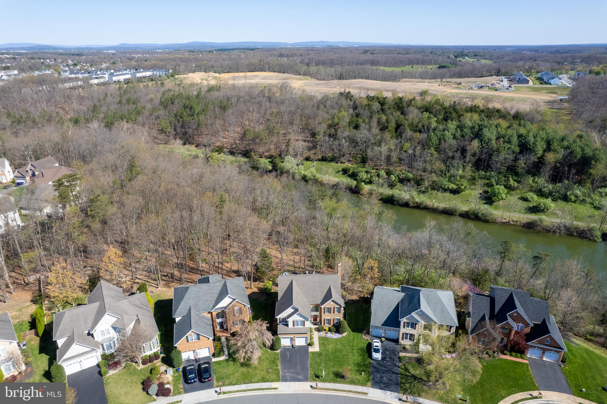 If you’re looking for a home that truly checks all the boxes, space, setting, style, and room to grow, this is the one you’ve been waiting for. Perfectly perched on a quiet cul-de-sac in the sought-after Twin Lakes Overlook neighborhood, this Toll Brothers built beauty offers more than curb appeal. It boasts a premium lot backing to the lake, with tranquil views that just might make you forget you’re so close to town.
Inside, the heart of the home is a showstopper kitchen with rich wood cabinetry, single wall oven, built in microwave, a gas cooktop, and gleaming granite counters. Whether you’re cooking up a storm or simply rinsing dishes, the woodsy view might have you happily distracted.
Prepare to be wowed by the two-story family room, where a dramatic brick fireplace stretches toward the cathedral ceiling. Thoughtful details throughout the home are evident in the hardwood floors, tray ceilings, crown molding, and chair rails. They add just the right touch of timeless elegance! Tucked privately behind the kitchen and near the garage entry, you’ll find a main-level office/library and laundry room, because convenience matters too.
Upstairs, the primary suite is its own little retreat, complete with a "Calgon, Take Me Away" bathroom featuring a two-person soaking tub, walk-in shower, a two sink vanity and space to truly unwind. Three additional bedrooms, a spacious hall bath, and a versatile loft round out the upper level.
Need more space? The unfinished walkout basement is bursting with potential. Whether you’re dreaming of a home gym, golf simulator, indoor bike loop, or the ultimate storage zone for everything you swear you’ll need someday, it’s ready when you are. Consider a renovation loan if you want to mortgage this upgrade once you become the owner. Talk to your favorite lender OR OURS about an FHA 203K, a Fannie Mae HomeStyle or a Freddie Mac CHOICERenovation loan.
When the weather’s right, the outdoor living spaces take center stage. Enjoy lazy afternoons on the deck under the retractable awning, host dinner parties on the lower patio, or follow the stone path to a hidden custom stone outdoor entertaining area with seating and firepit that’s just begging for string lights and s’mores.
Twin Lakes Overlook is a gem of a community with mature landscaping, walking trails, and a beautifully maintained lake that adds to the everyday magic. All of this, with easy access to commuter routes, shopping, dining, and everything Winchester has to offer.
Come see why 109 Aulee Court isn’t just a house—it’s the one that finally feels like home. There is a full list of updates and upgrades available, just ask.