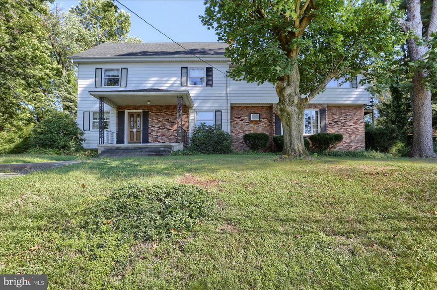 Over 3200 sf home includes  an approx. 570 sf  2nd floor in-law suite with outside entrance.  Property  sits on an acre of land in Derry Township  School district.  Great potential with limitless possibilities. Small vineyard, mature trees, garden area, spectacular sunset views.  Main 2 1/2 story portion  of this home is a log home that could be beautifully restored. Immense Family Room or Great Room addition, features a stone wall wood burning fireplace that currently has a pellet stove insert for backup heating.  Slate entry, sunken floor, 10" beamed ceiling all add character to this room. The 1st floor also features a large country Kitchen, a formal Dining Room, a Sunroom, 1/2 bath, Laundry closet and a very large Screened Porch.  Between the Sunroom and the Screened Porch is a covered brick patio with a Skylight. On the Second Level you will find 4 Bedrooms and one full Bath, plus the in-law suite with a second Living Room, full bath, second eat-in Kitchen and a Bedroom with a walk-in closet. You have a staircase to the attic in one of the bedrooms. The attic is another area that has many possibilities.  Detached 2 1/2 car Garage adds extra storage space that could also be a work shop. This home needs a buyer with a good vision of what this home could be in the future.  Your remodeling and updating touches will make this property spectacular.  More photos to follow.
